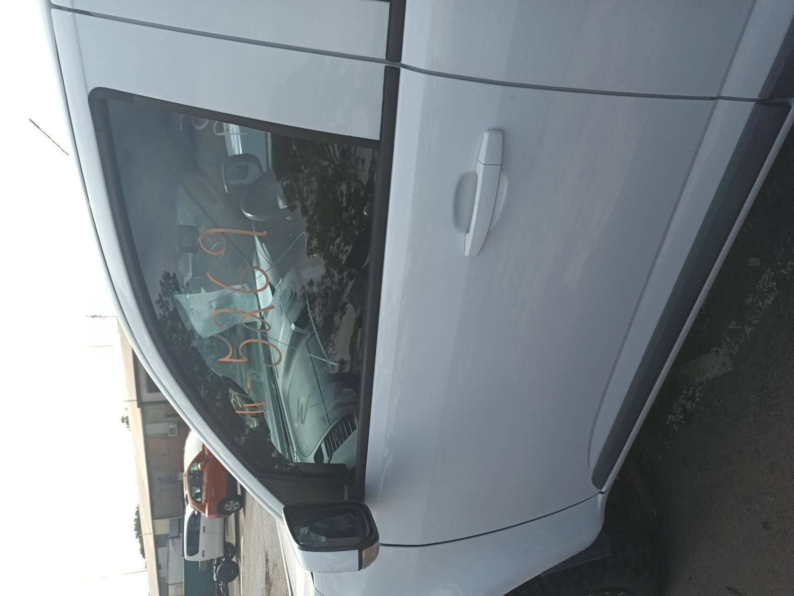 A White Car with a Broken Windshield is Parked in a Parking Lot — South West 4WD Wreckers In Brisbane, QLD