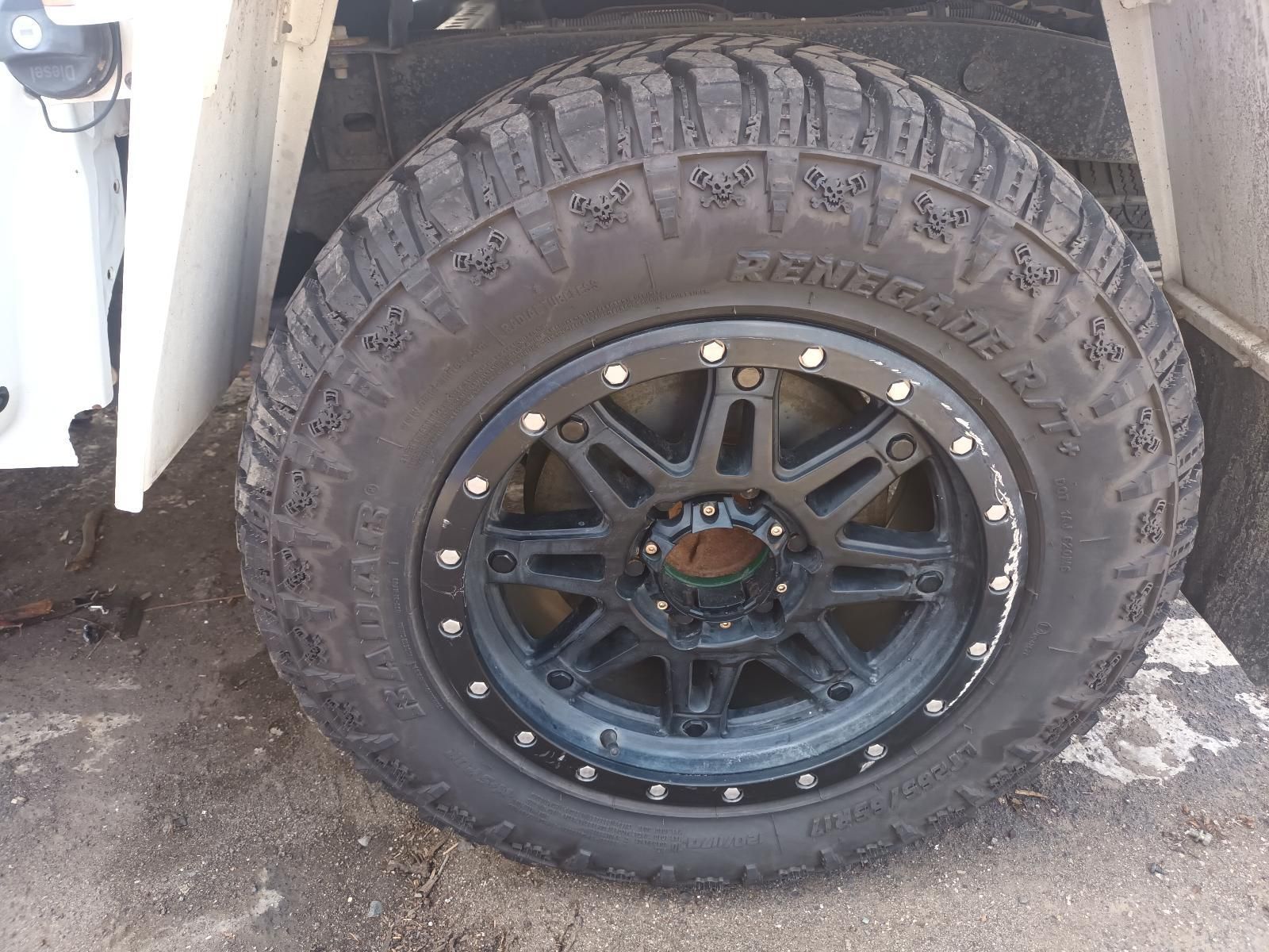 A Close Up of a Black Tire on a White Truck — South West 4WD Wreckers In Brisbane, QLD