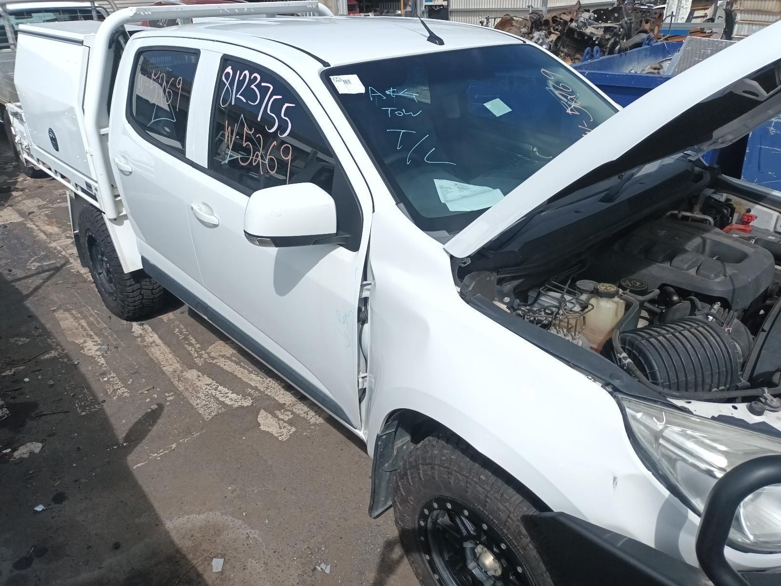 A White Pickup Truck with the Hood Up is Sitting on the Ground — South West 4WD Wreckers In Brisbane, QLD