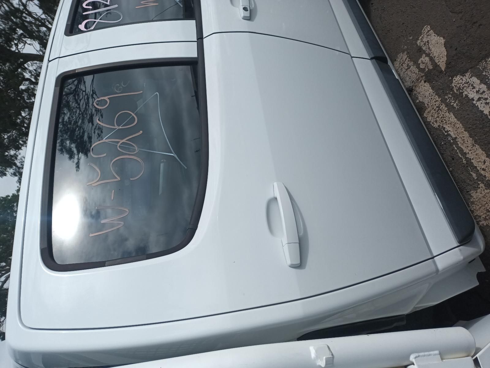 A White Truck is Parked on the Side of the Road — South West 4WD Wreckers In Brisbane, QLD
