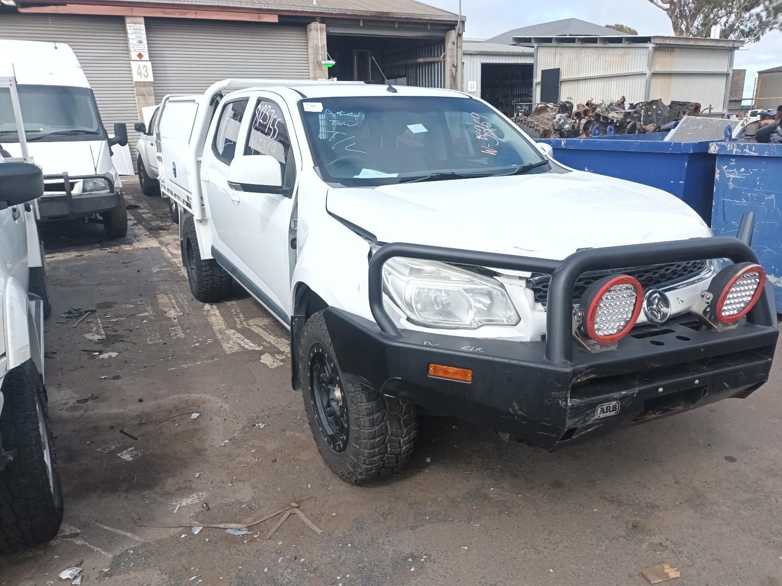 A White Truck with a Black Bumper is Parked in a Parking Lot — South West 4WD Wreckers In Brisbane, QLD