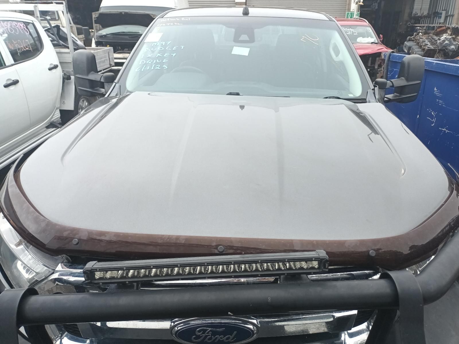 A Ford Ranger is Parked in a Lot with Other Cars — South West 4WD Wreckers In Brisbane, QLD