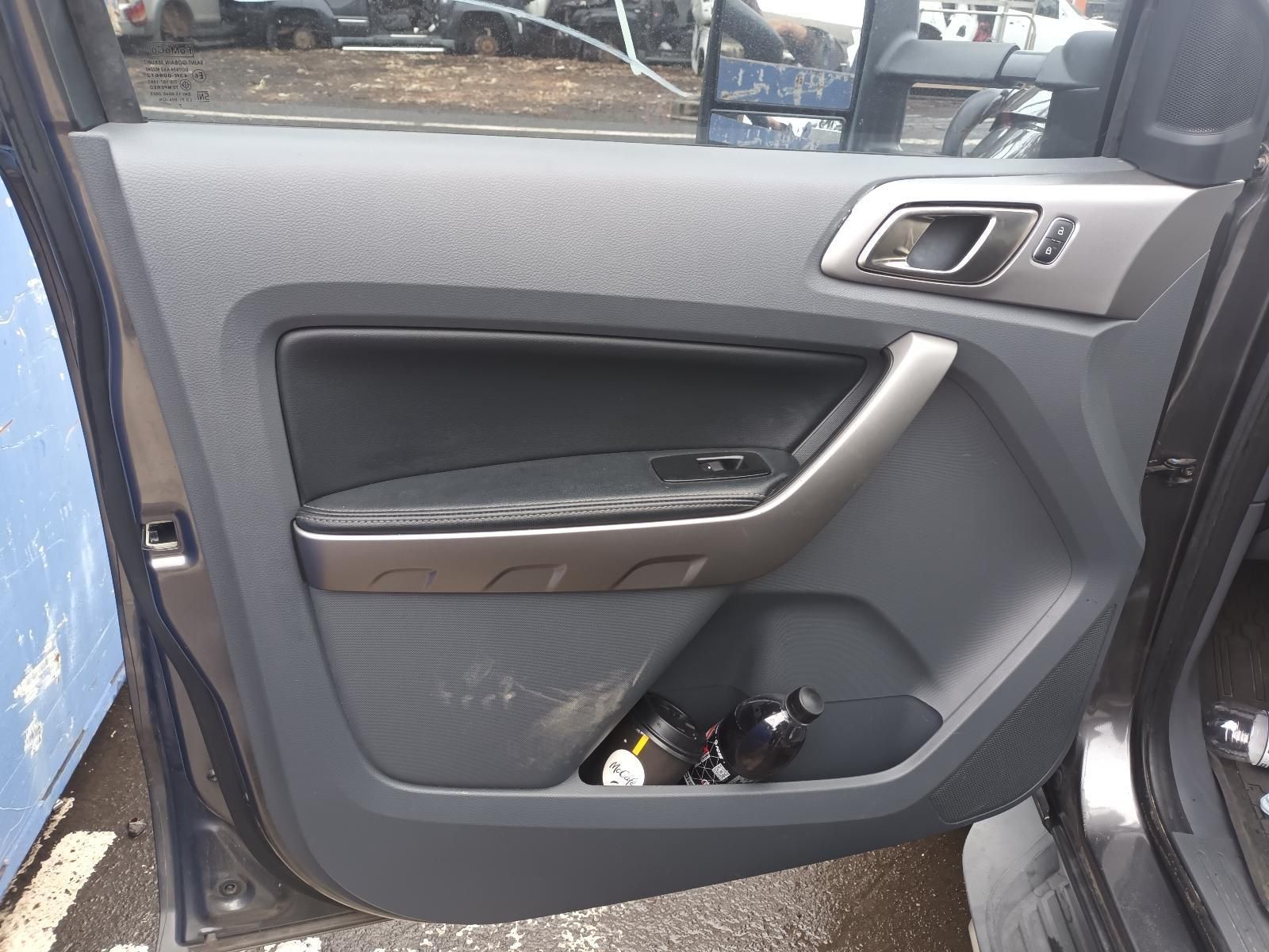 A Close Up of a Car Door with a Bottle in It — South West 4WD Wreckers In Brisbane, QLD