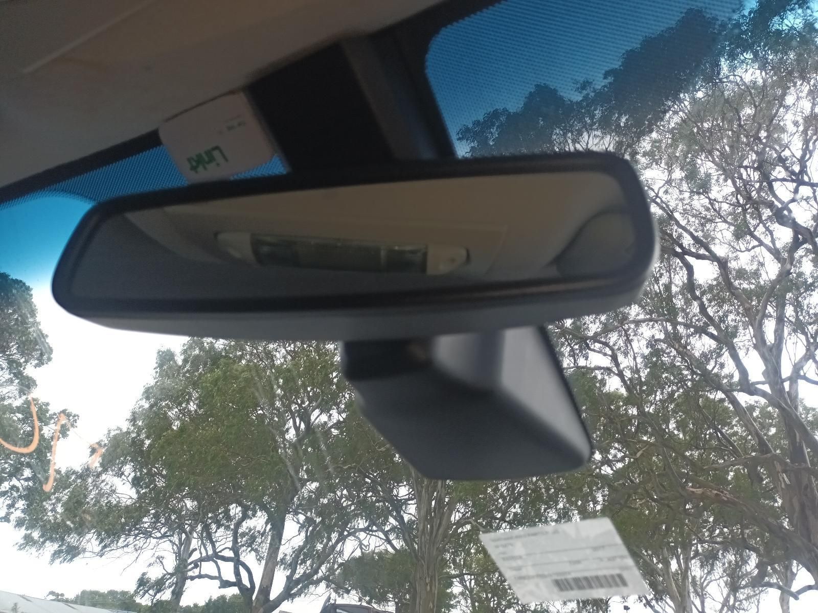 A Rear View Mirror on a Car with Trees in the Background — South West 4WD Wreckers In Brisbane, QLD