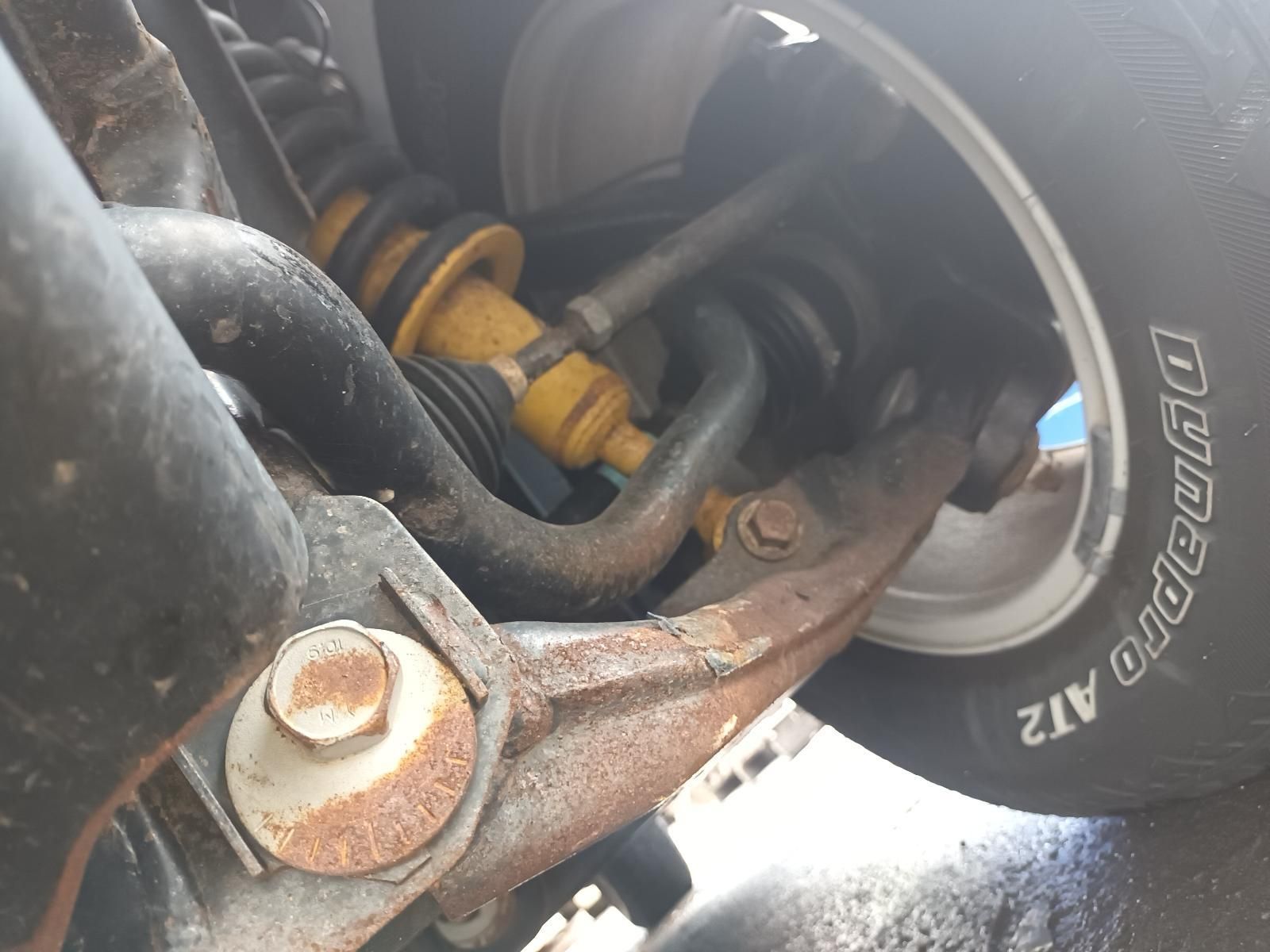 A Close Up of a Suspension and a Tire That Says Dynapro At2 — South West 4WD Wreckers In Brisbane, QLD