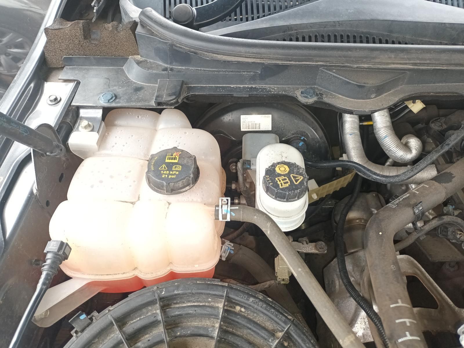 A Close Up of a Car Engine with a Water Tank and a Brake Fluid Tank — South West 4WD Wreckers In Brisbane, QLD