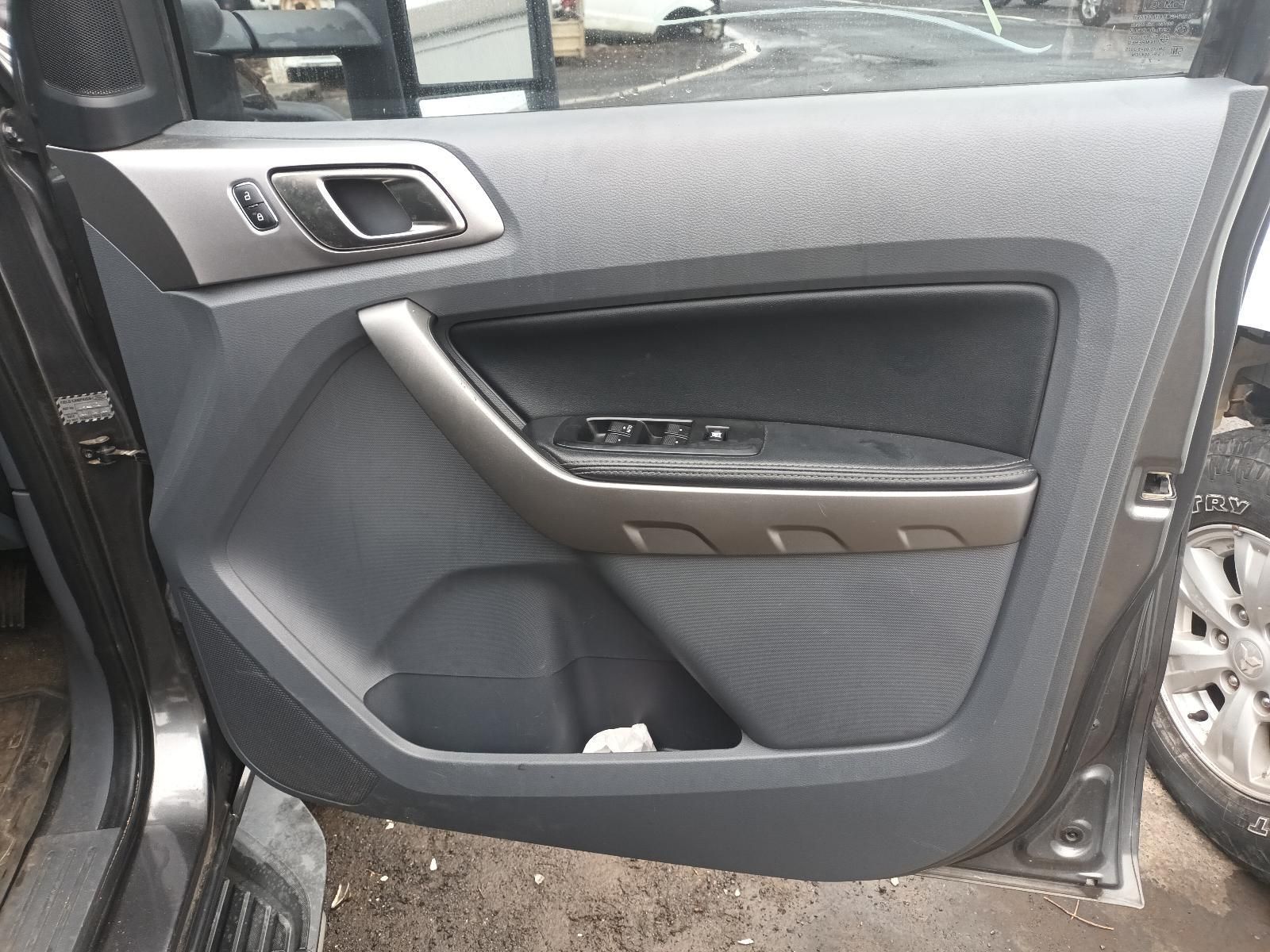 The Door of a Ford Ranger is Open and Sitting on the Ground — South West 4WD Wreckers In Brisbane, QLD