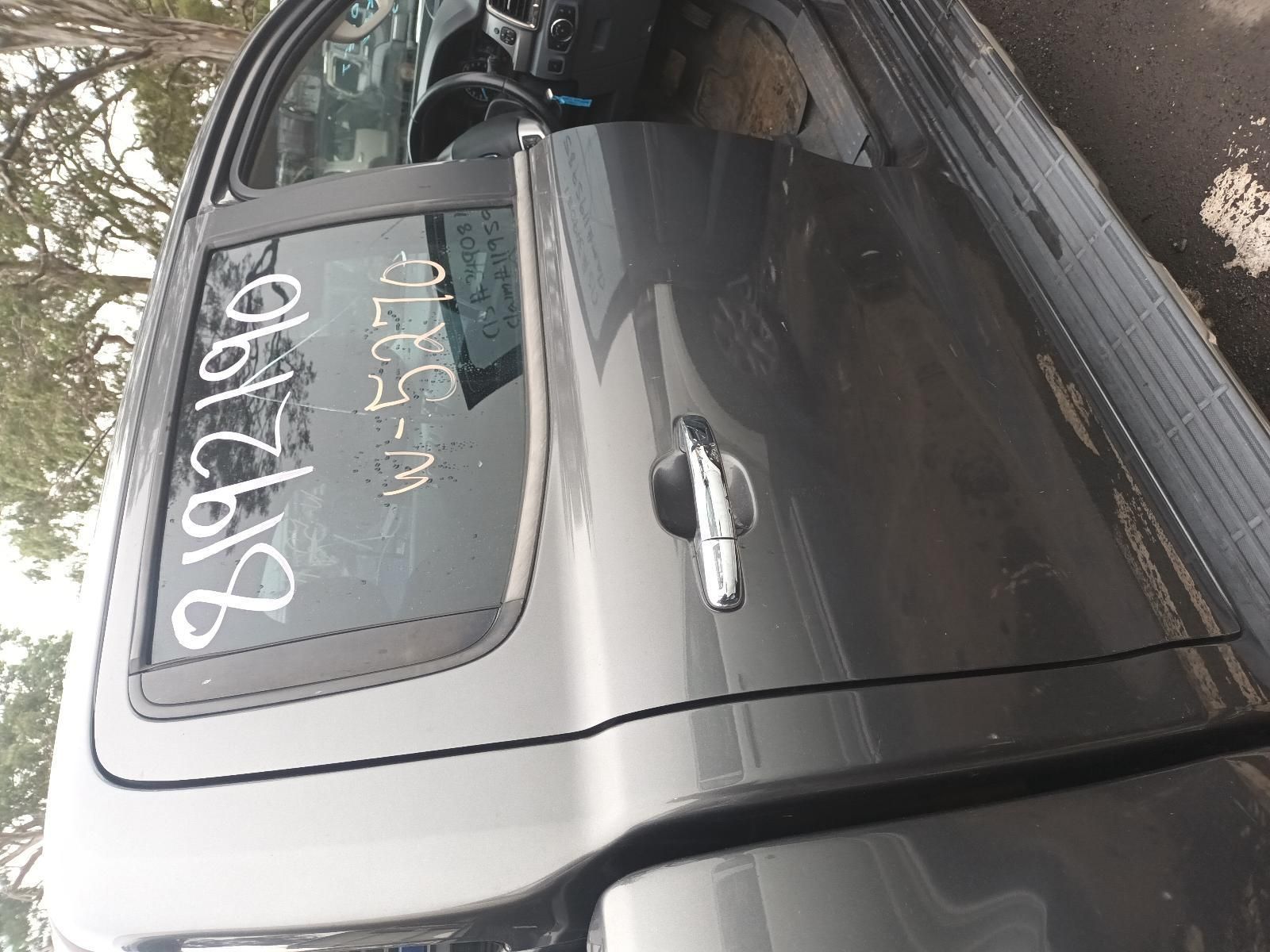 A Gray Truck is Parked in a Parking Lot with the Door Open — South West 4WD Wreckers In Brisbane, QLD