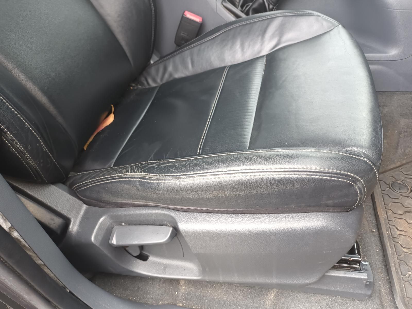 A Black Leather Seat in a Car with a Broken Arm Rest — South West 4WD Wreckers In Brisbane, QLD
