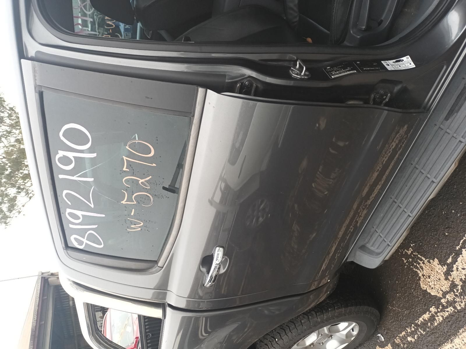 A Gray Truck with the Door Open is Parked on the Side of the Road — South West 4WD Wreckers In Brisbane, QLD