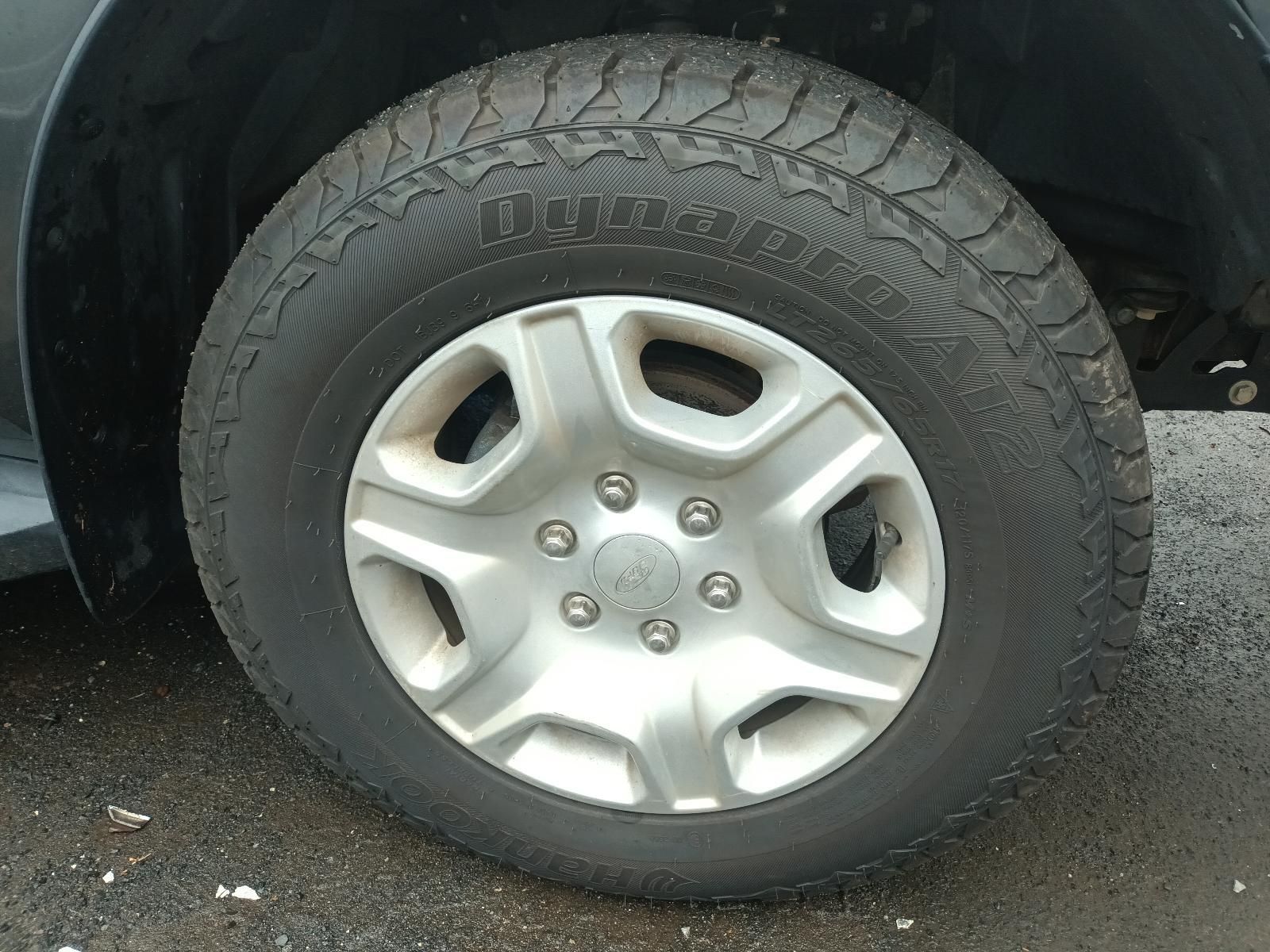 A Close Up of a Tire on a Black Car — South West 4WD Wreckers In Brisbane, QLD