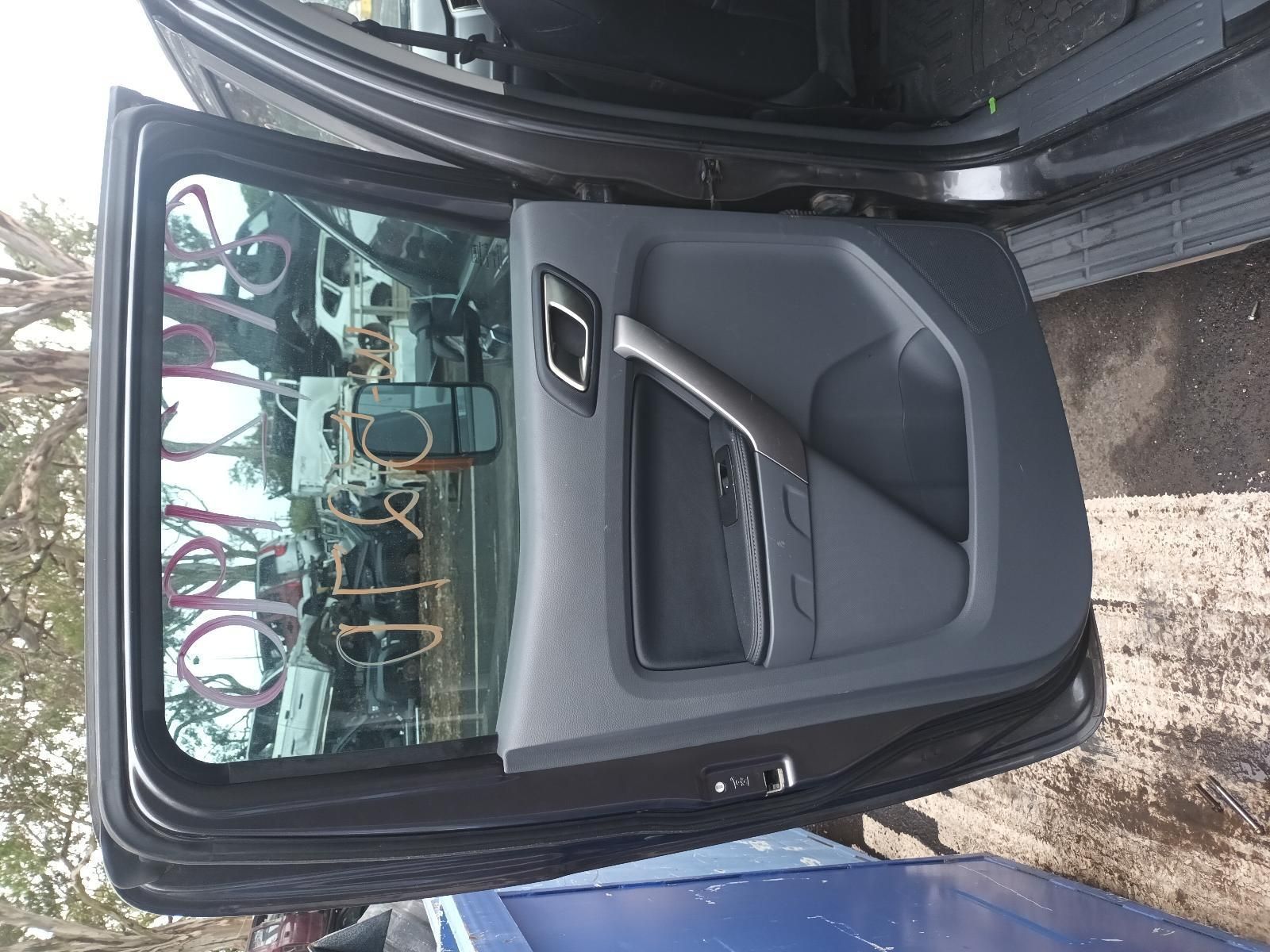 A Black Car with the Door Open and the Rear View Mirror Visible — South West 4WD Wreckers In Brisbane, QLD