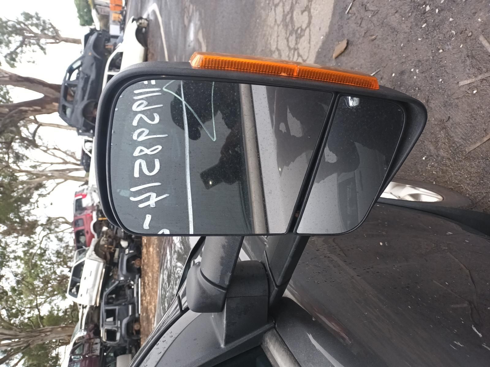 A Rear View Mirror on a Car Has the Numbers 411284201 Written on It — South West 4WD Wreckers In Brisbane, QLD