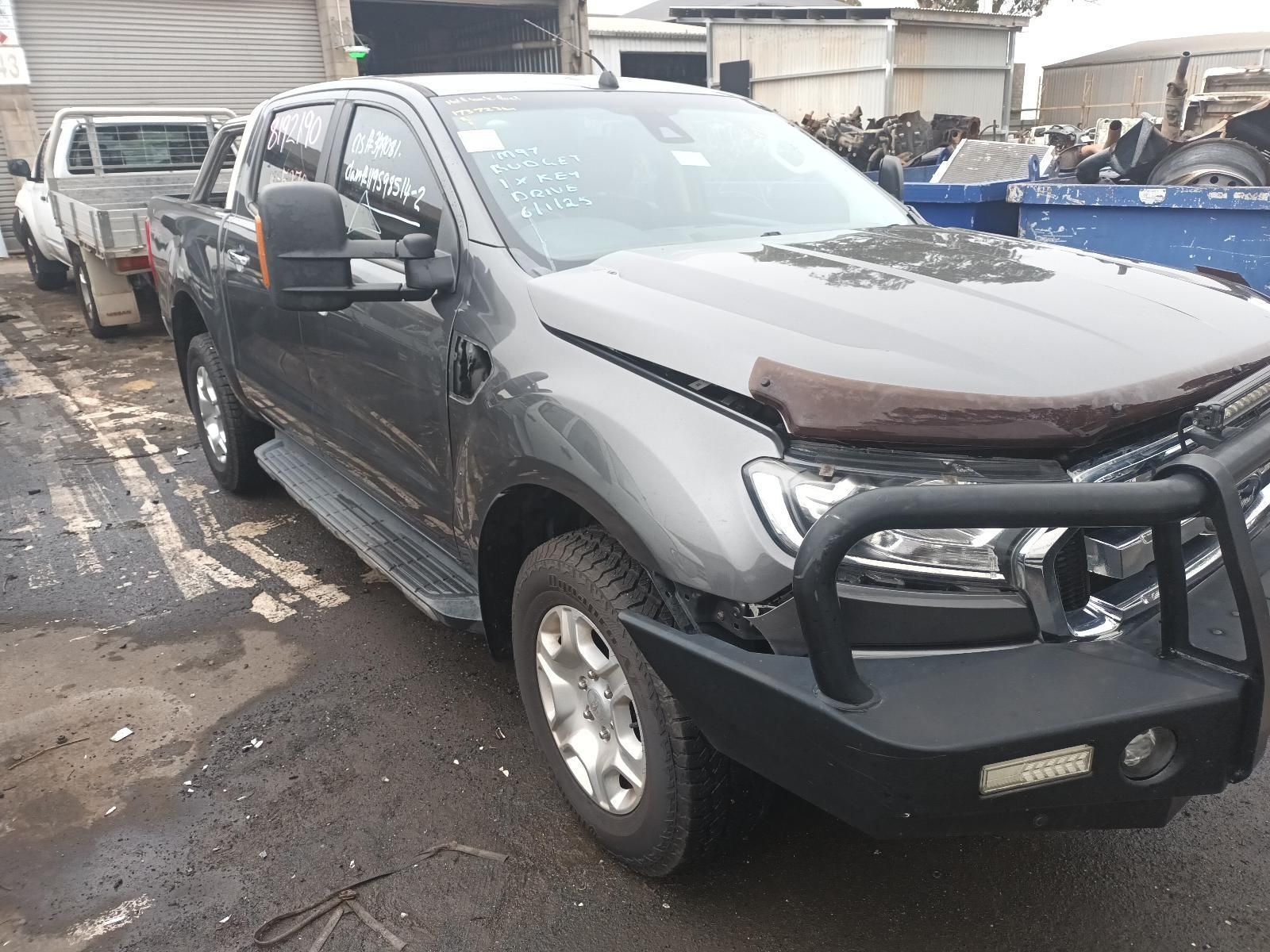 A Gray Truck with a Black Bumper is Parked in a Parking Lot — South West 4WD Wreckers In Brisbane, QLD