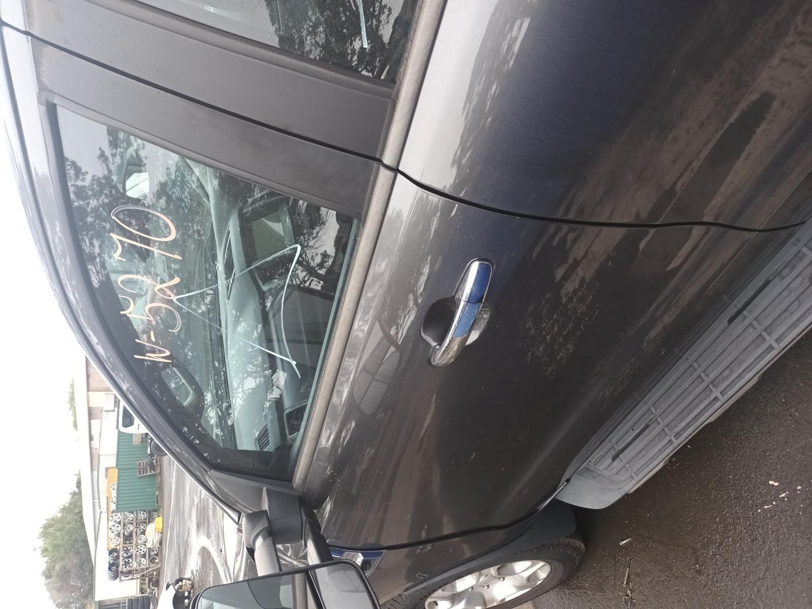 A Gray Car is Parked on the Side of the Road — South West 4WD Wreckers In Brisbane, QLD