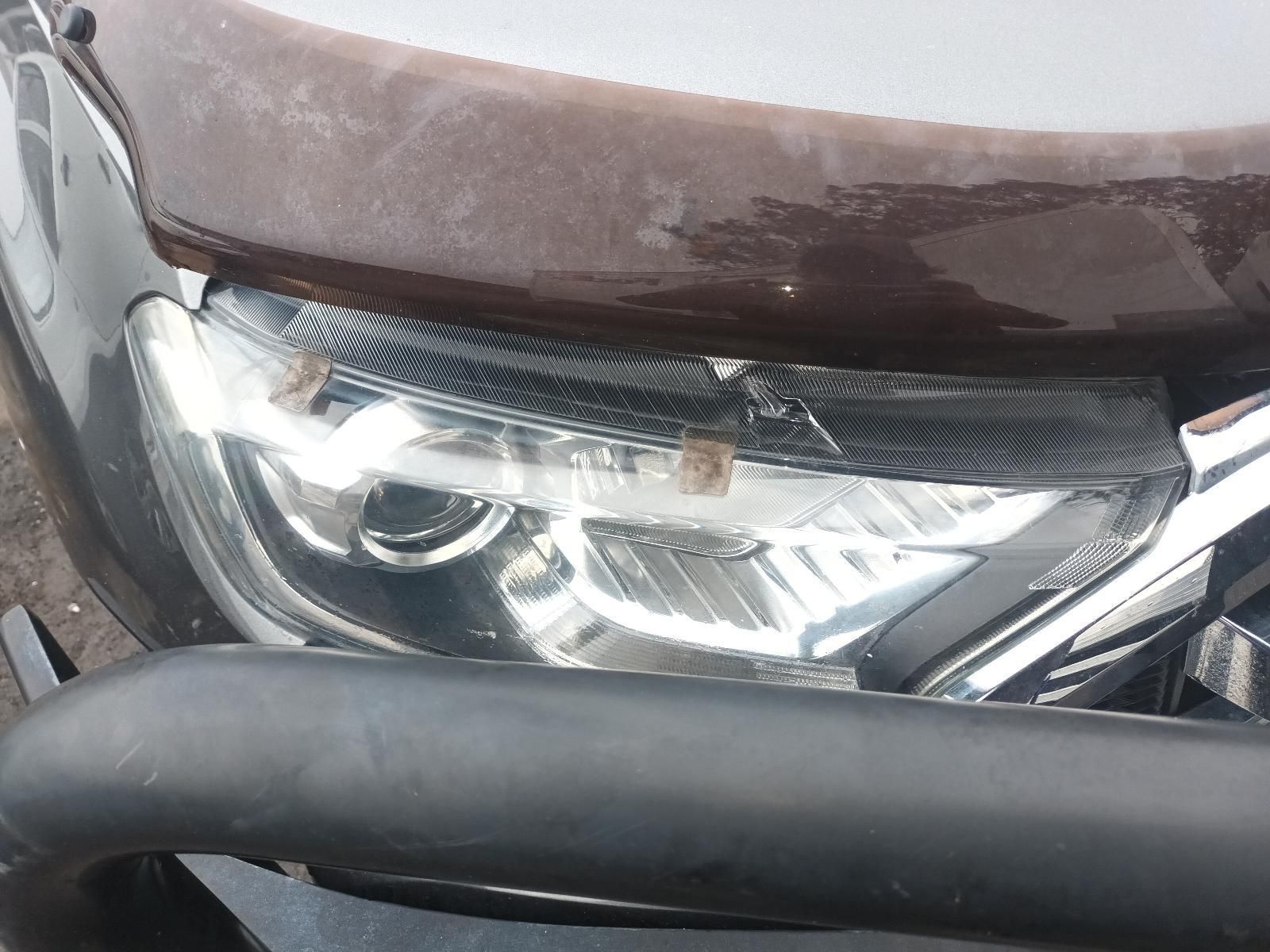 A Close Up of a Car 's Headlight and Hood — South West 4WD Wreckers In Brisbane, QLD