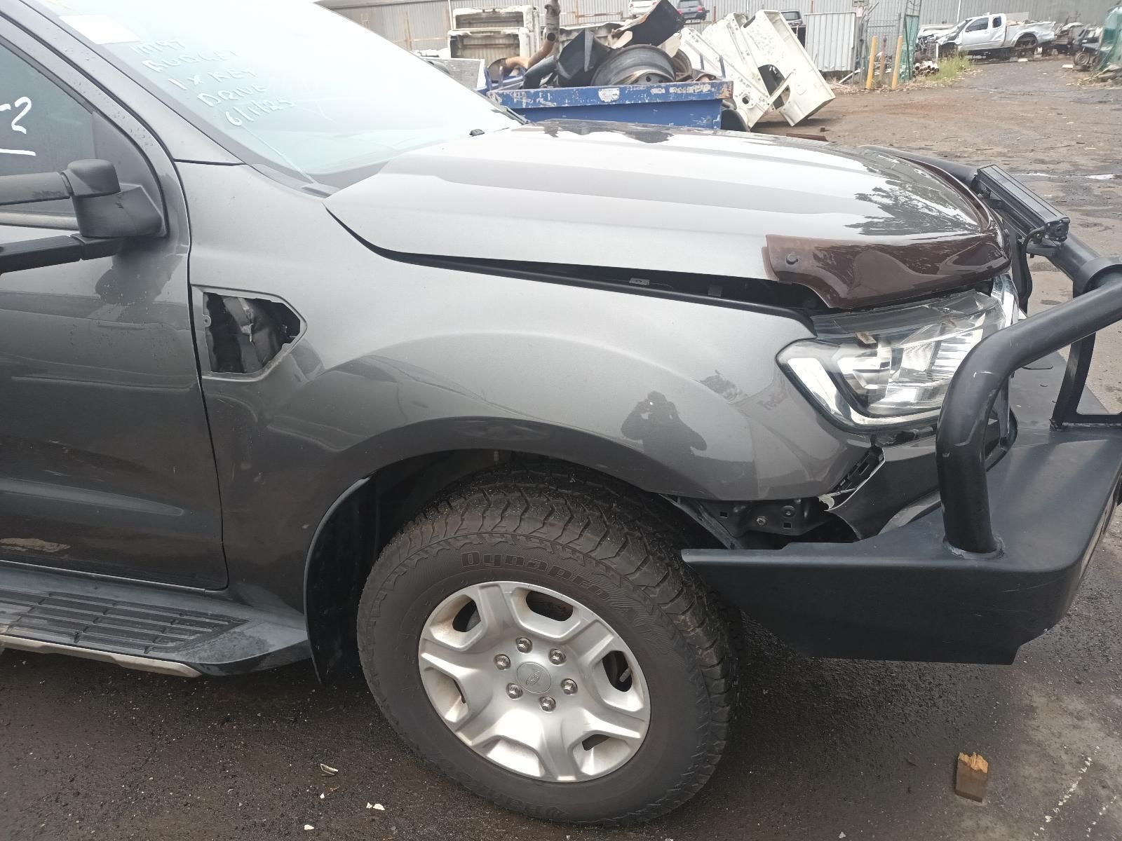 A Gray Truck with a Black Bumper is Parked in a Parking Lot — South West 4WD Wreckers In Brisbane, QLD