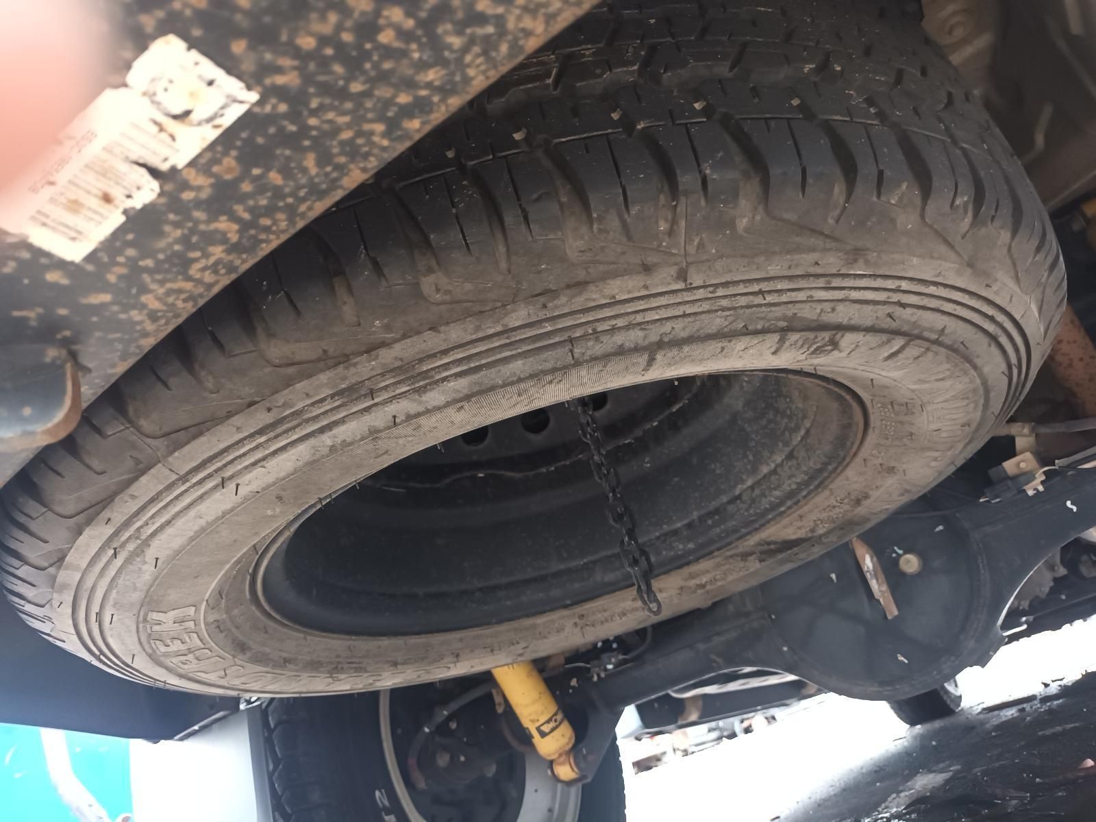 A Close Up of a Tire on a Car with a Chain Attached to It — South West 4WD Wreckers In Brisbane, QLD