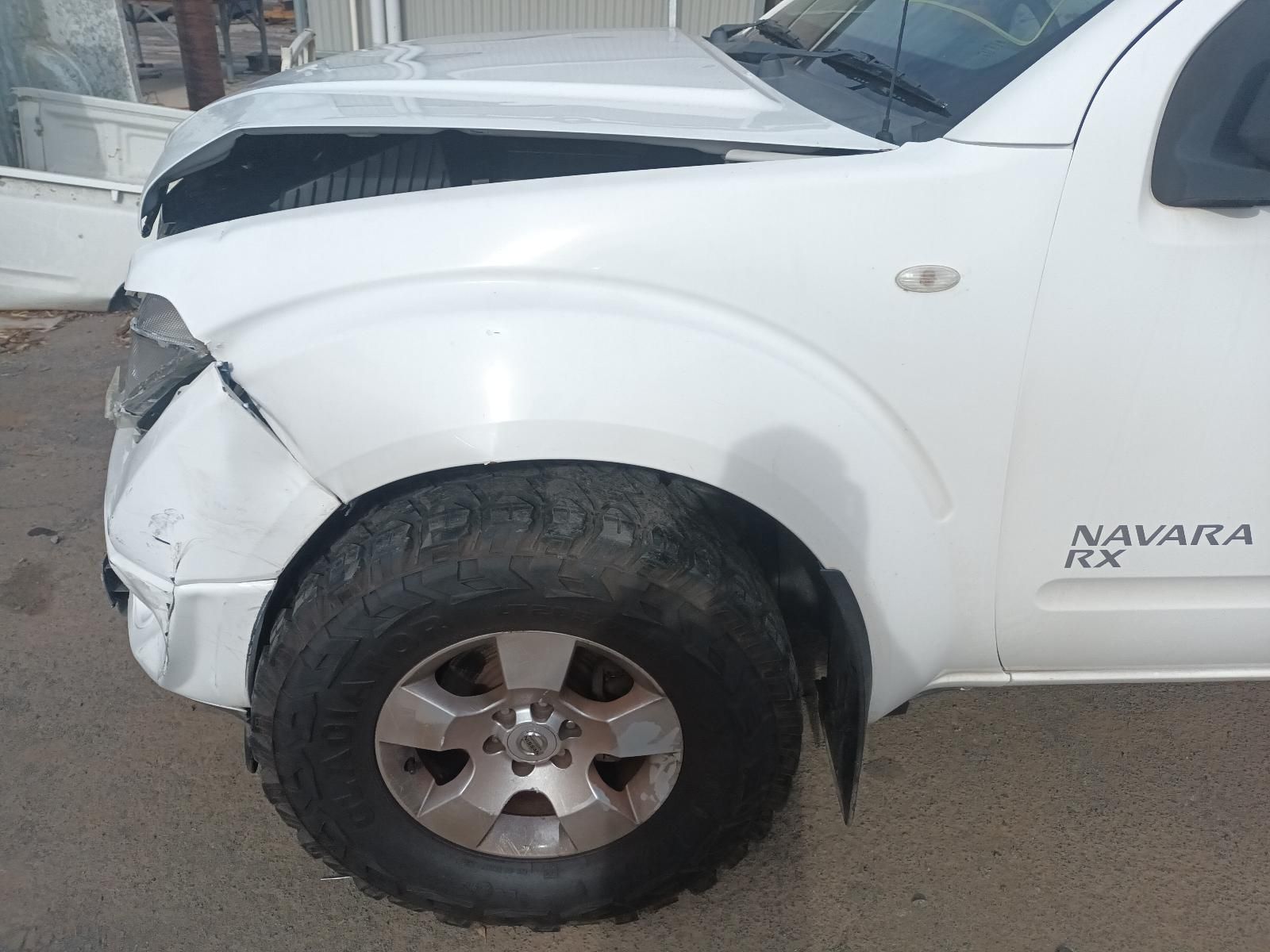 A White Nissan Navara with a Damaged Hood — South West 4WD Wreckers In Brisbane, QLD