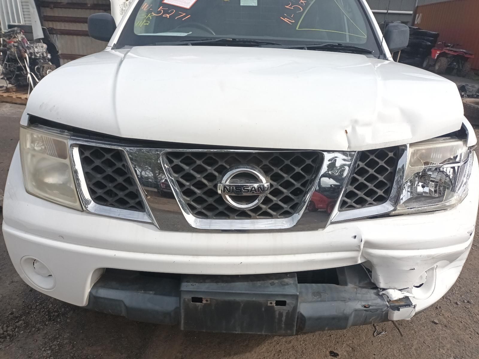 A White Nissan Truck with a Damaged Front End is Parked — South West 4WD Wreckers In Brisbane, QLD