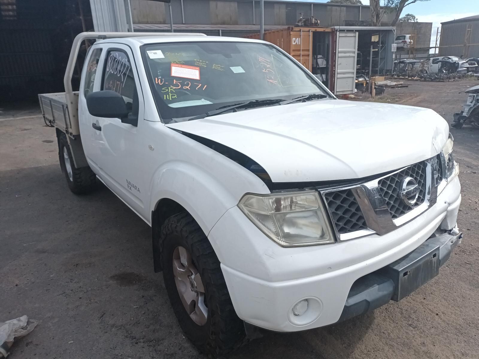 A White Nissan Truck is Parked in a Parking Lot — South West 4WD Wreckers In Brisbane, QLD