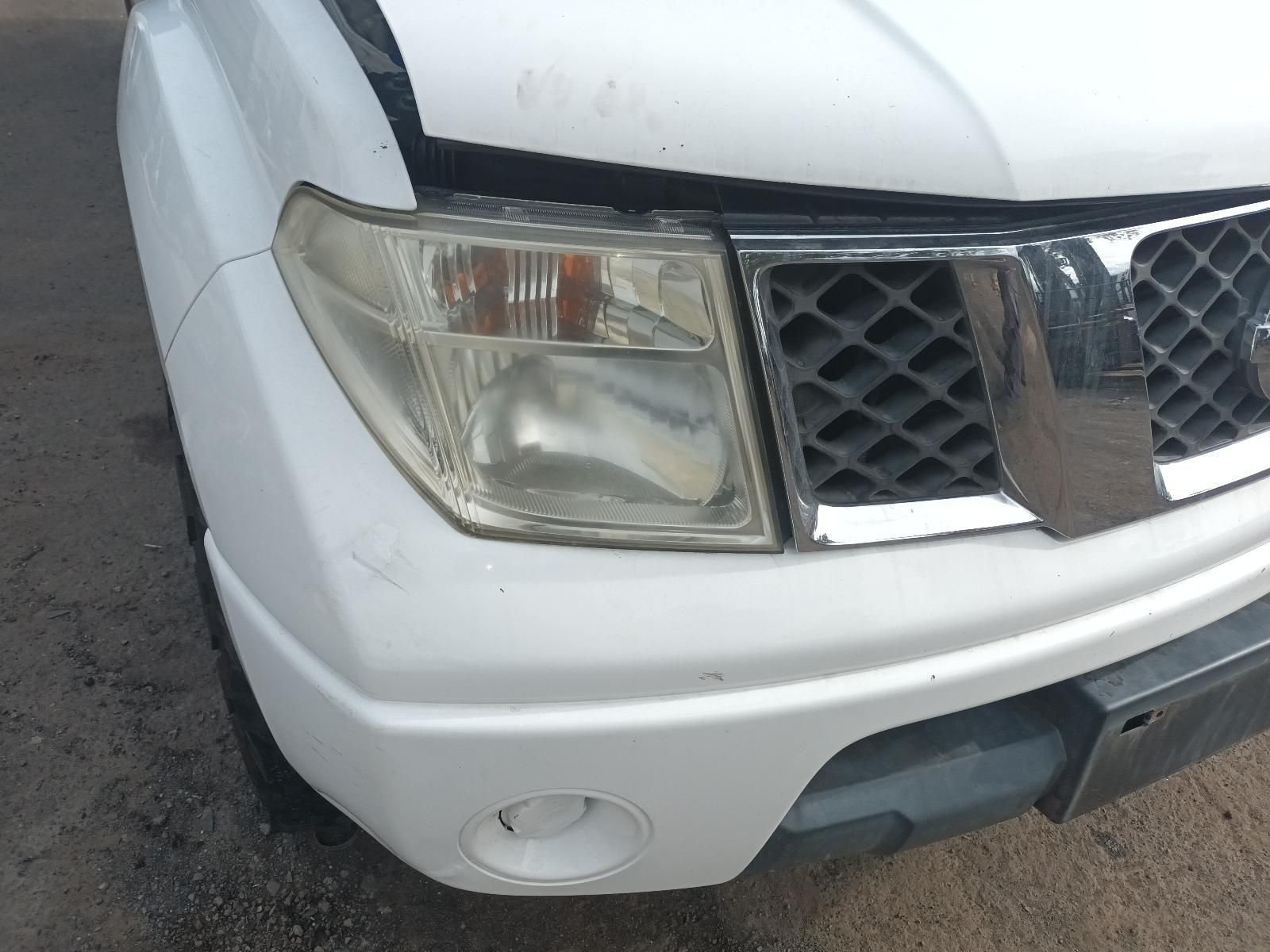 A White Car with a Broken Hood and Headlight — South West 4WD Wreckers In Brisbane, QLD