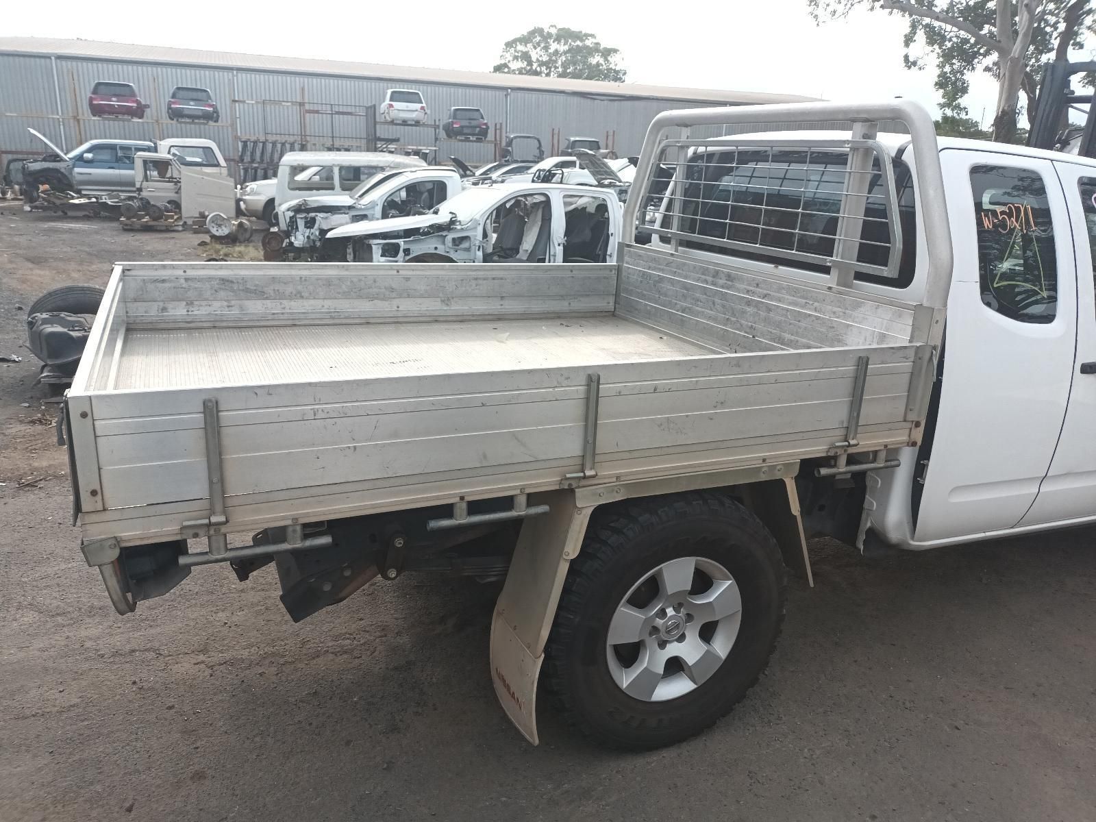 A White Truck with a Tray on the Back is Parked in a Lot — South West 4WD Wreckers In Brisbane, QLD