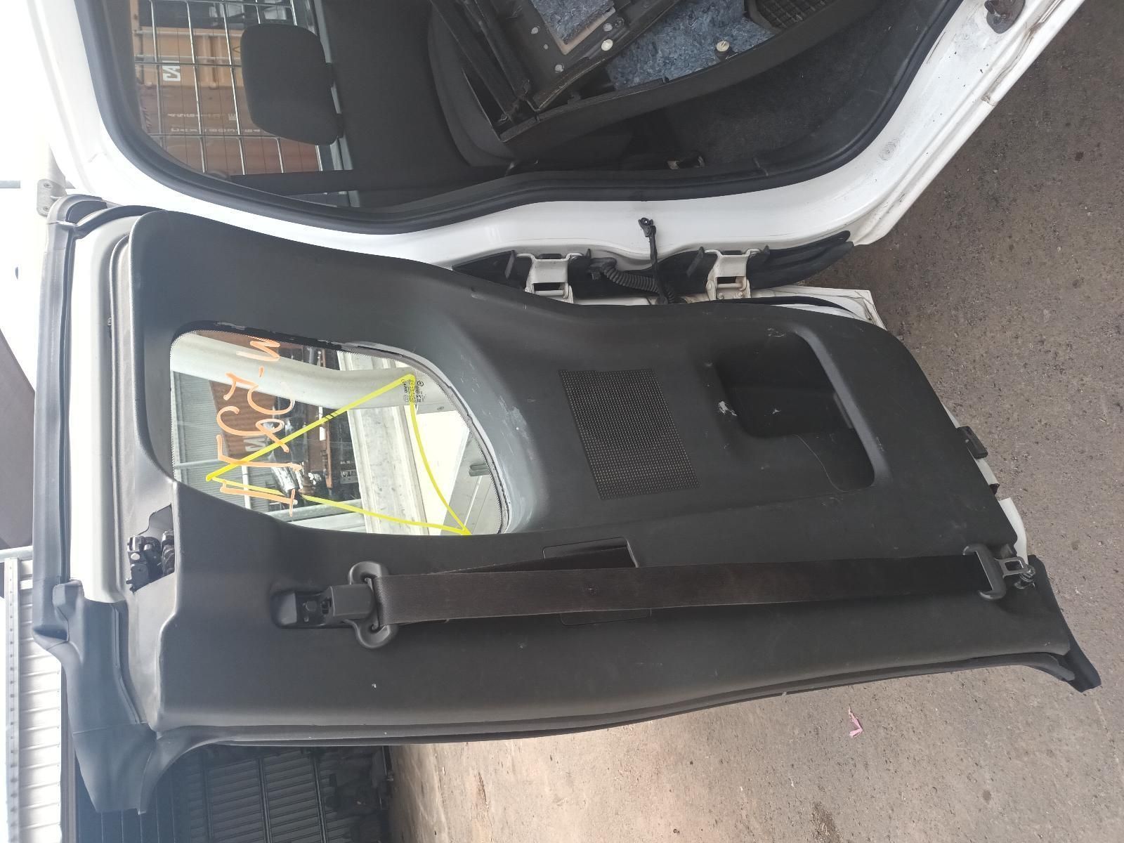 The Back Door of a White Car is Being Removed — South West 4WD Wreckers In Brisbane, QLD