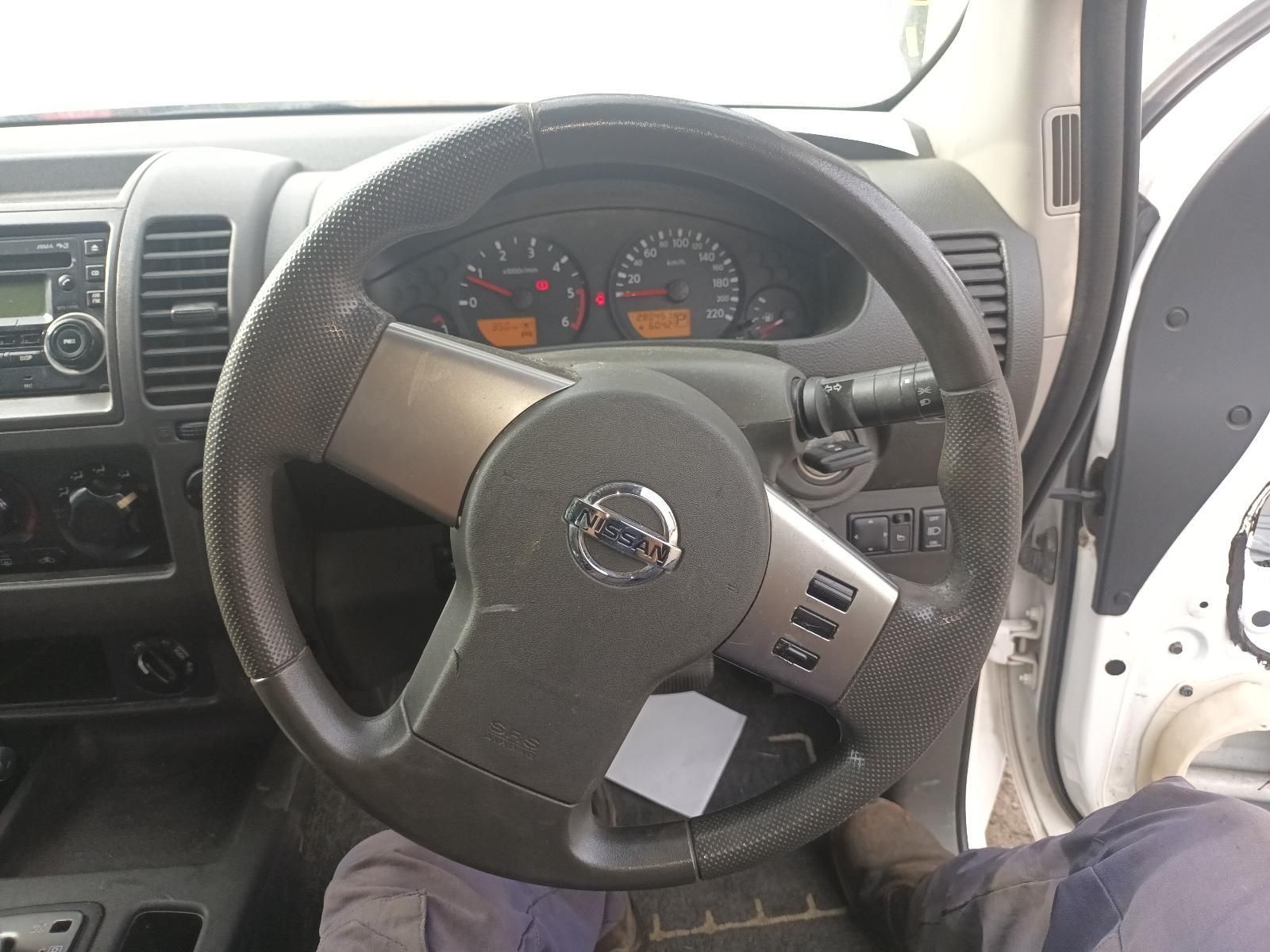 ThE Steering Wheel of a White Nissan Car — South West 4WD Wreckers In Brisbane, QLD