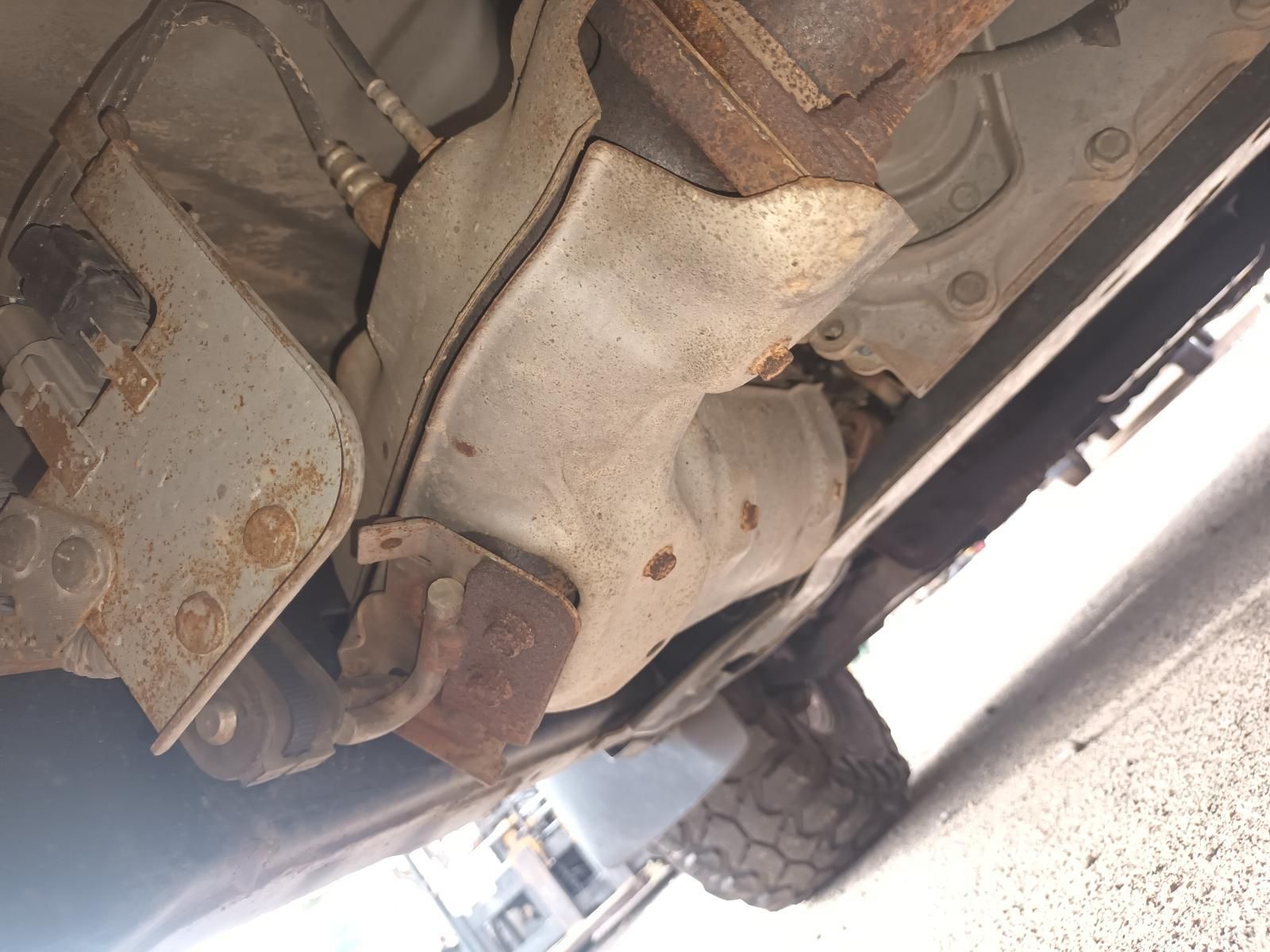 A Close Up of the Underside of a Car with a Rusty Exhaust Pipe — South West 4WD Wreckers In Brisbane, QLD
