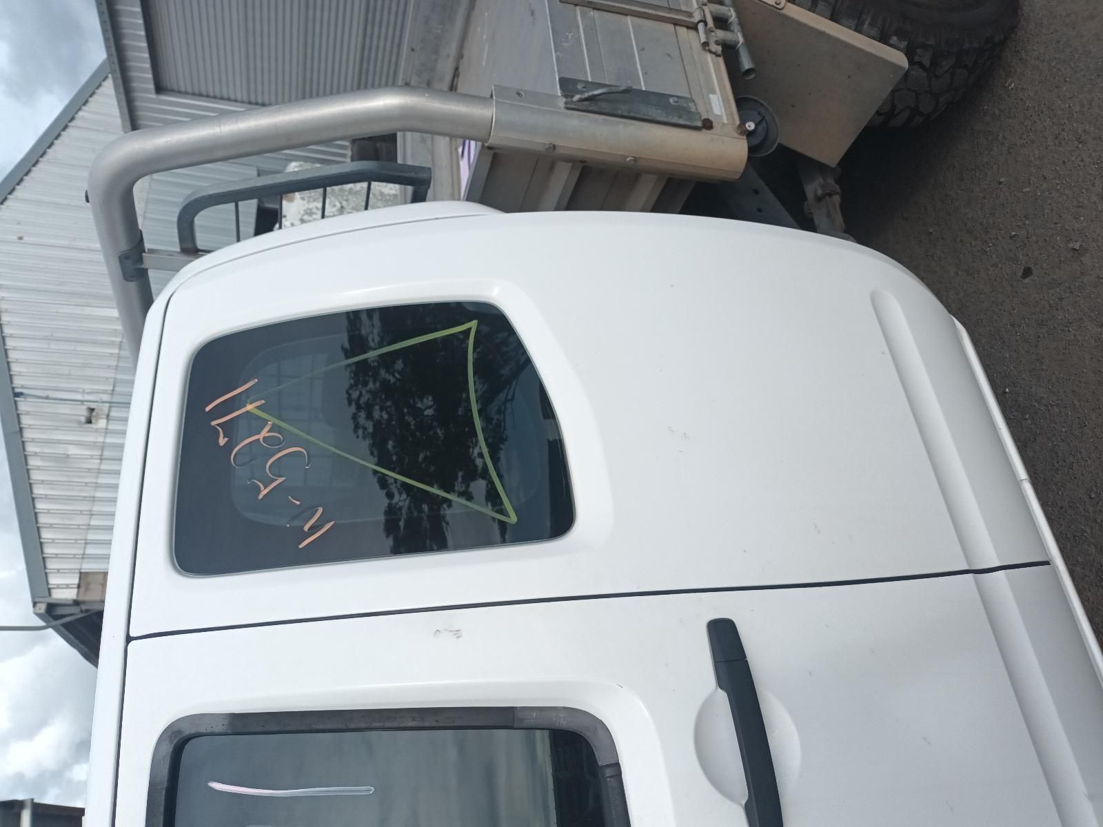 A White Truck is Parked in Front of a Building — South West 4WD Wreckers In Brisbane, QLD
