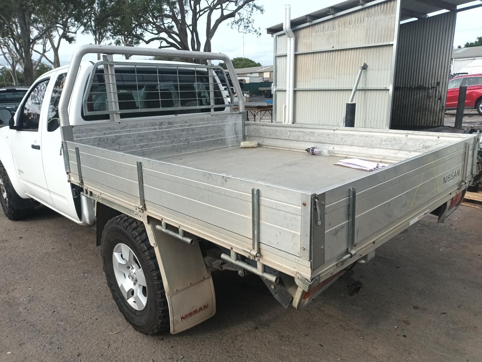 A White Truck with a Flat Bed is Parked in a Parking Lot — South West 4WD Wreckers In Brisbane, QLD