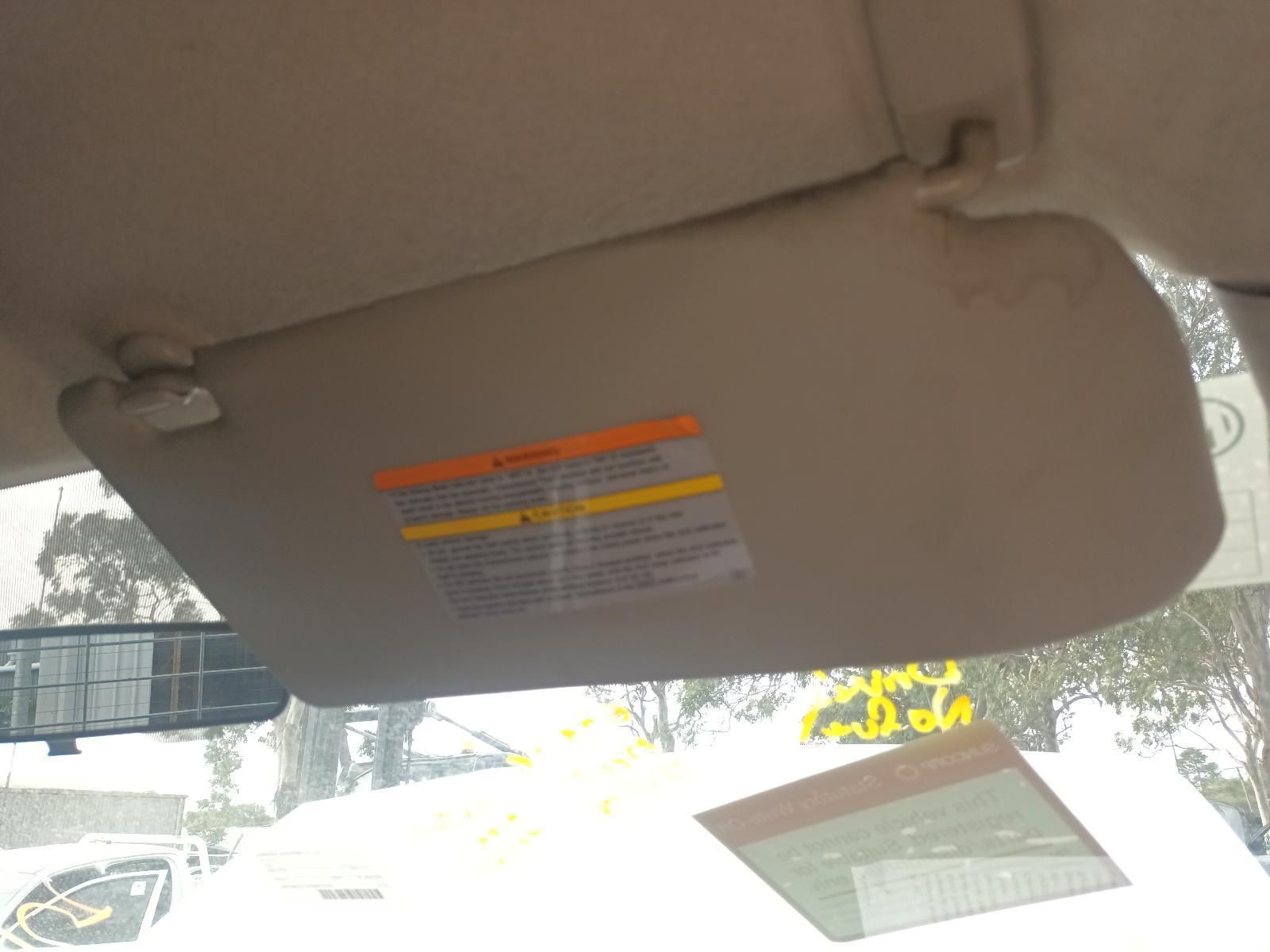 A Sun Visor with a Warning Label on It — South West 4WD Wreckers In Brisbane, QLD