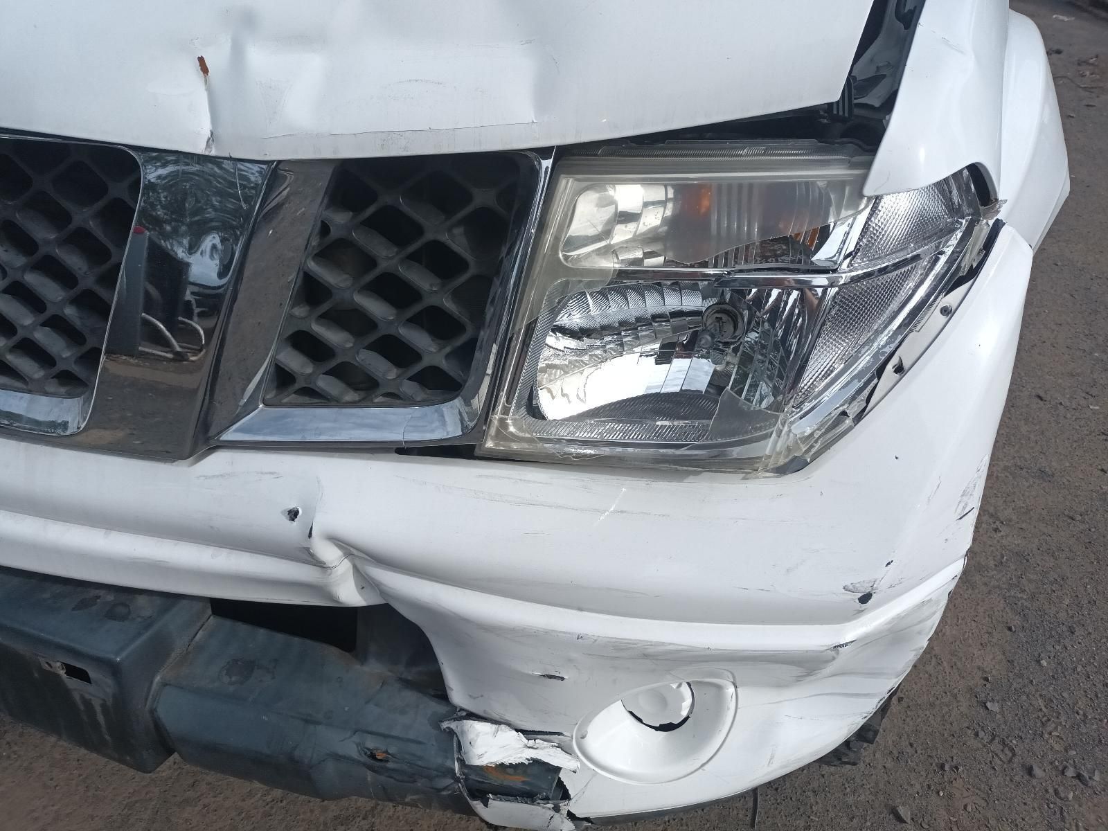 A White Car with a Damaged Bumper and Headlight — South West 4WD Wreckers In Brisbane, QLD