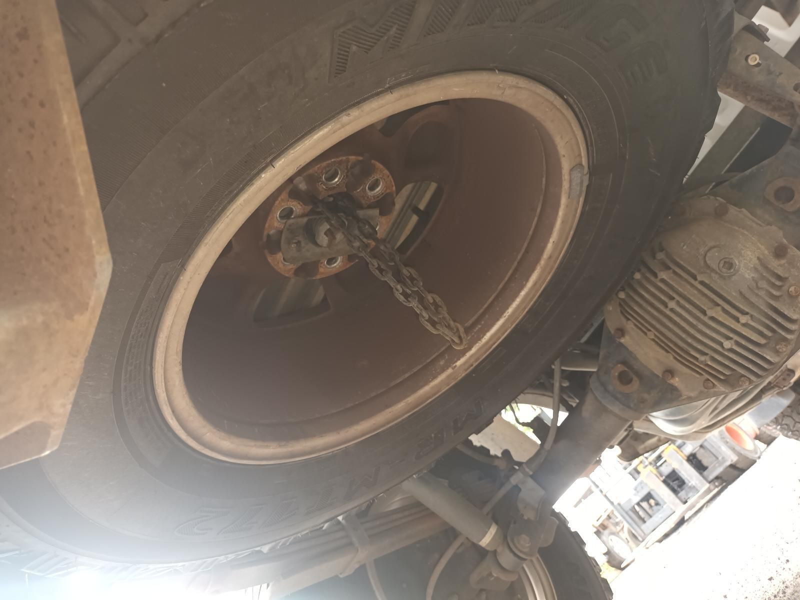 A Close Up of a Tire with a Chain Attached to It — South West 4WD Wreckers In Brisbane, QLD