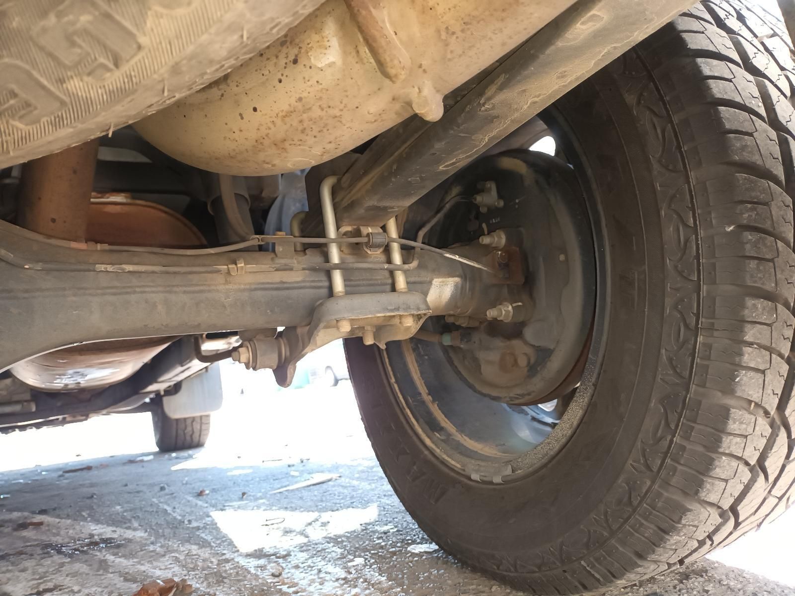 A Close Up of the Underside of a Car with a Tire — South West 4WD Wreckers in Harristown, QLD