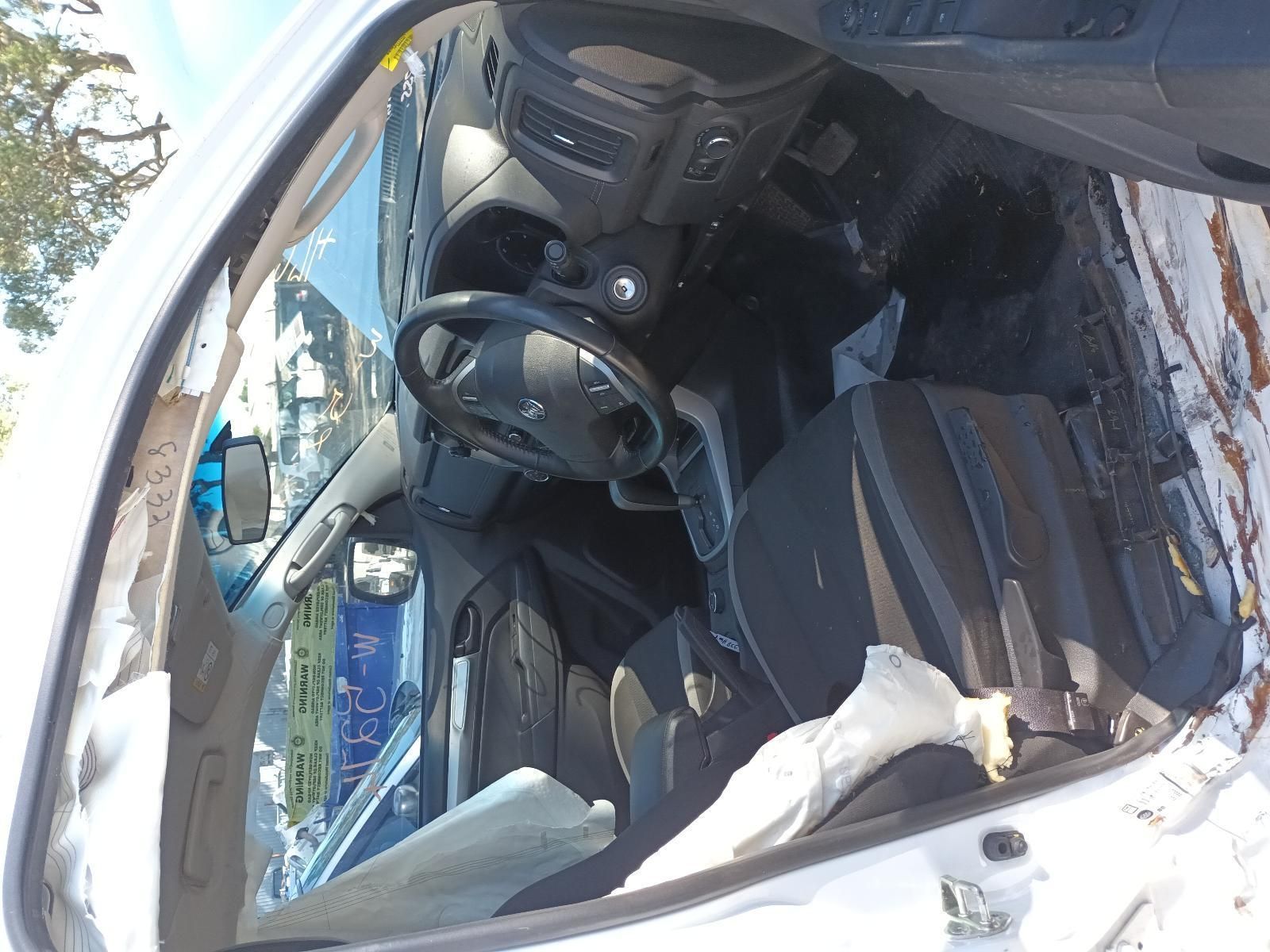 The Inside of a Wrecked Car with a Steering Wheel and Seats — South West 4WD Wreckers in Harristown, QLD