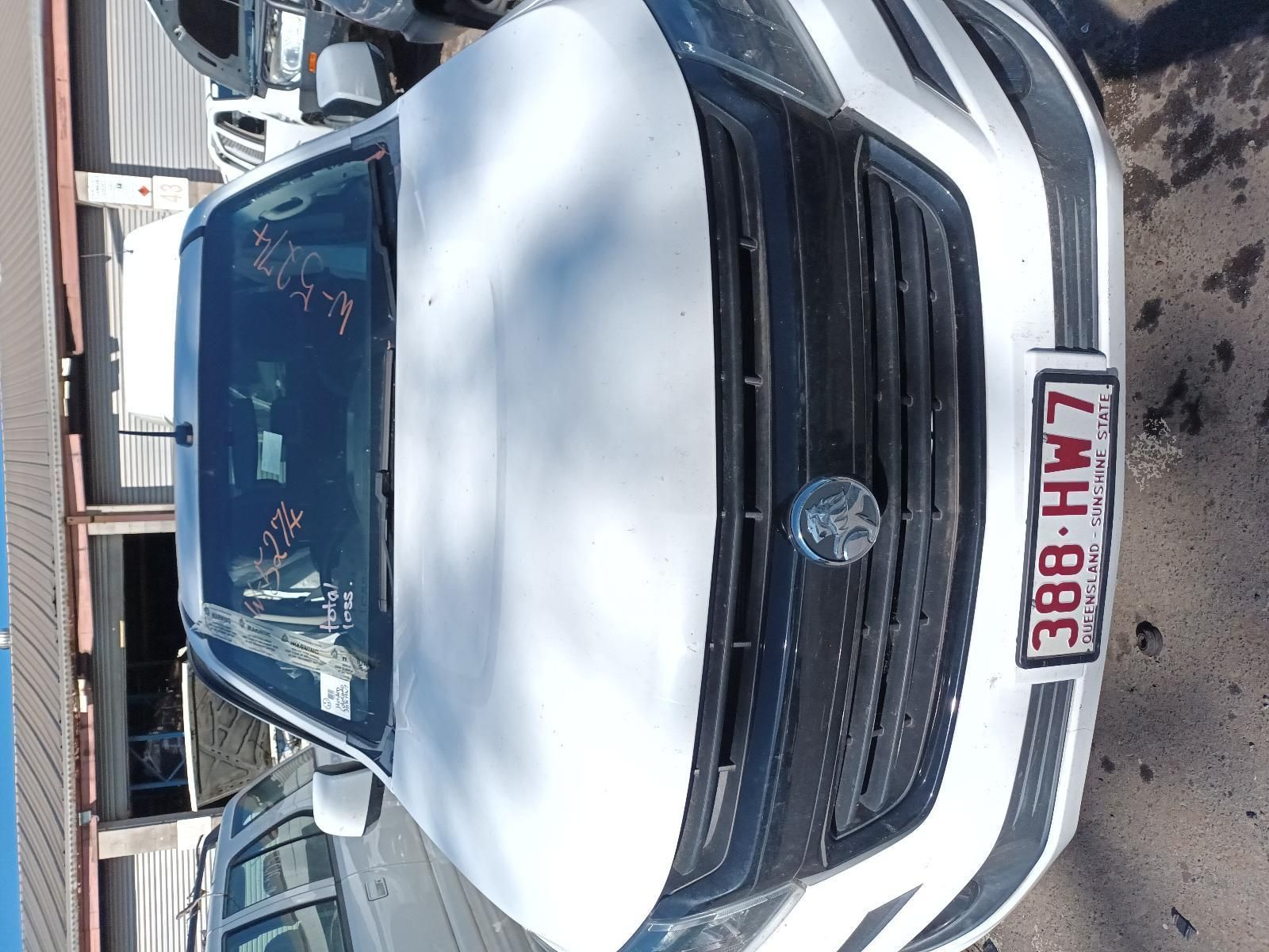 A White Car with a License Plate — South West 4WD Wreckers in Harristown, QLD