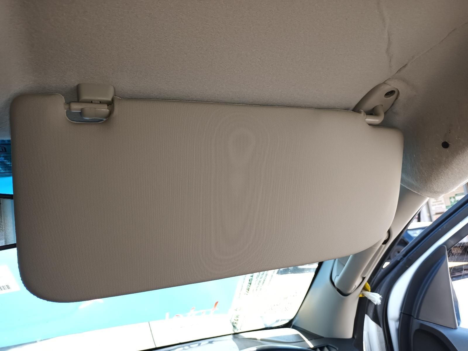 A Tan Sun Visor is Hanging from the Ceiling of a Car — South West 4WD Wreckers in Harristown, QLD