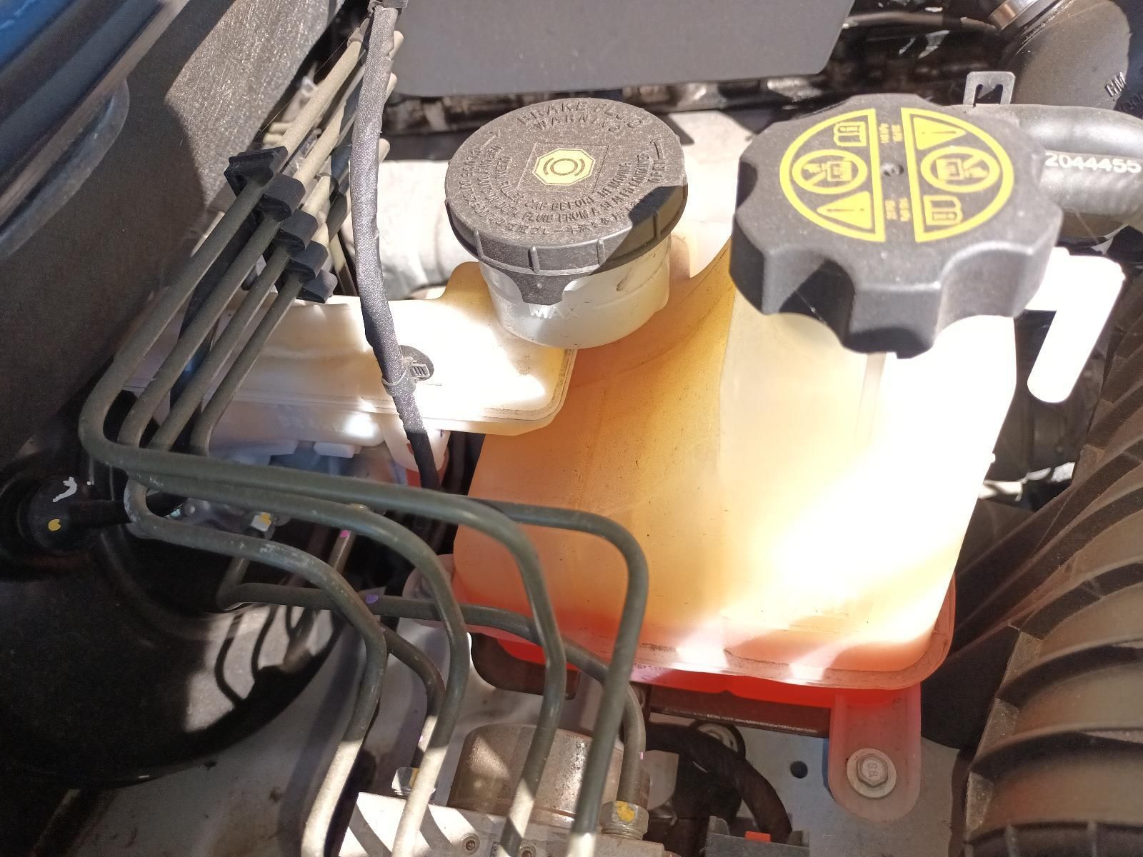 A Close Up of a Car Engine with a Warning Label on the Cap — South West 4WD Wreckers in Harristown, QLD