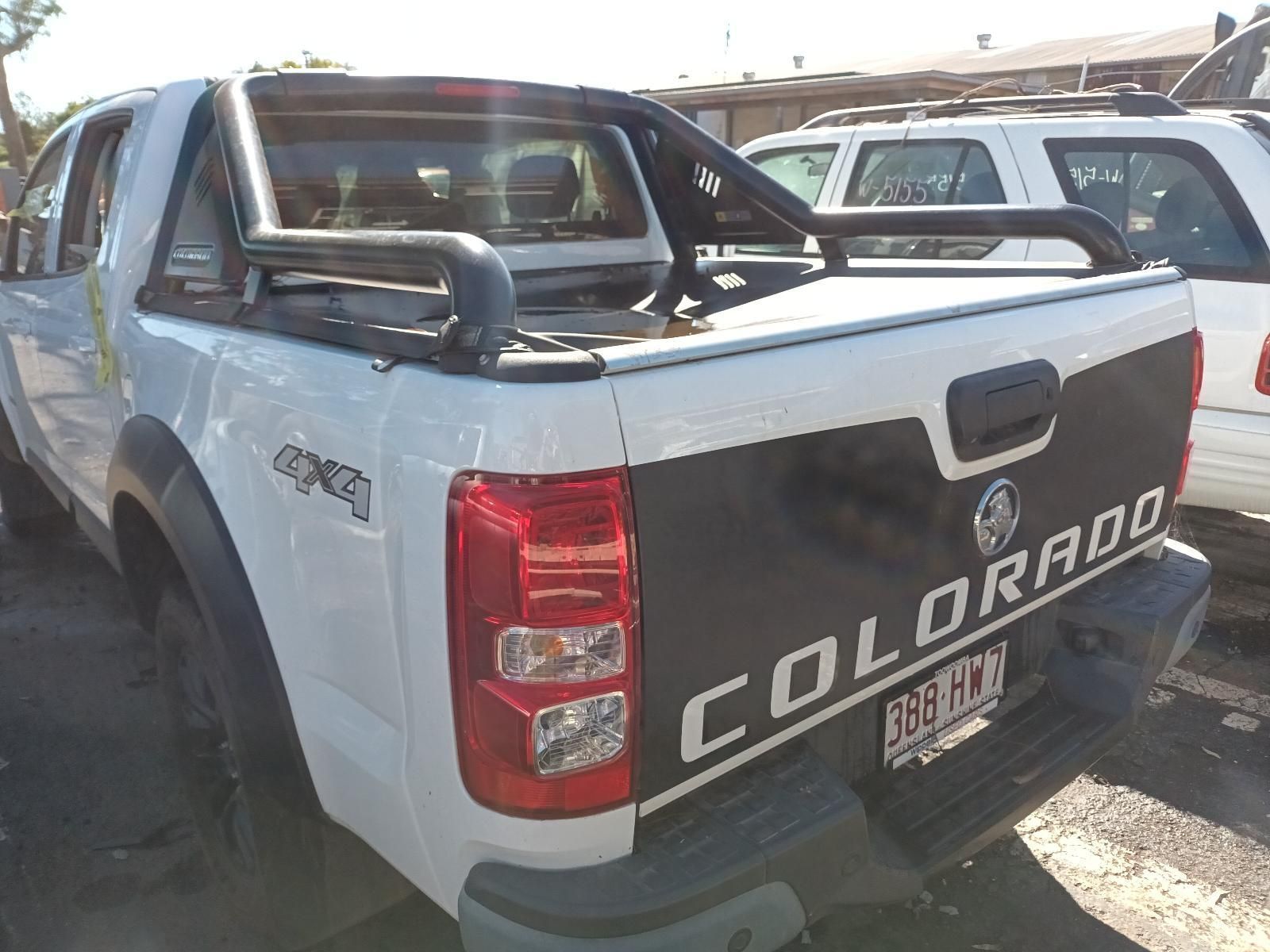 A White Colorado Truck is Parked in a Parking Lot — South West 4WD Wreckers in Harristown, QLD