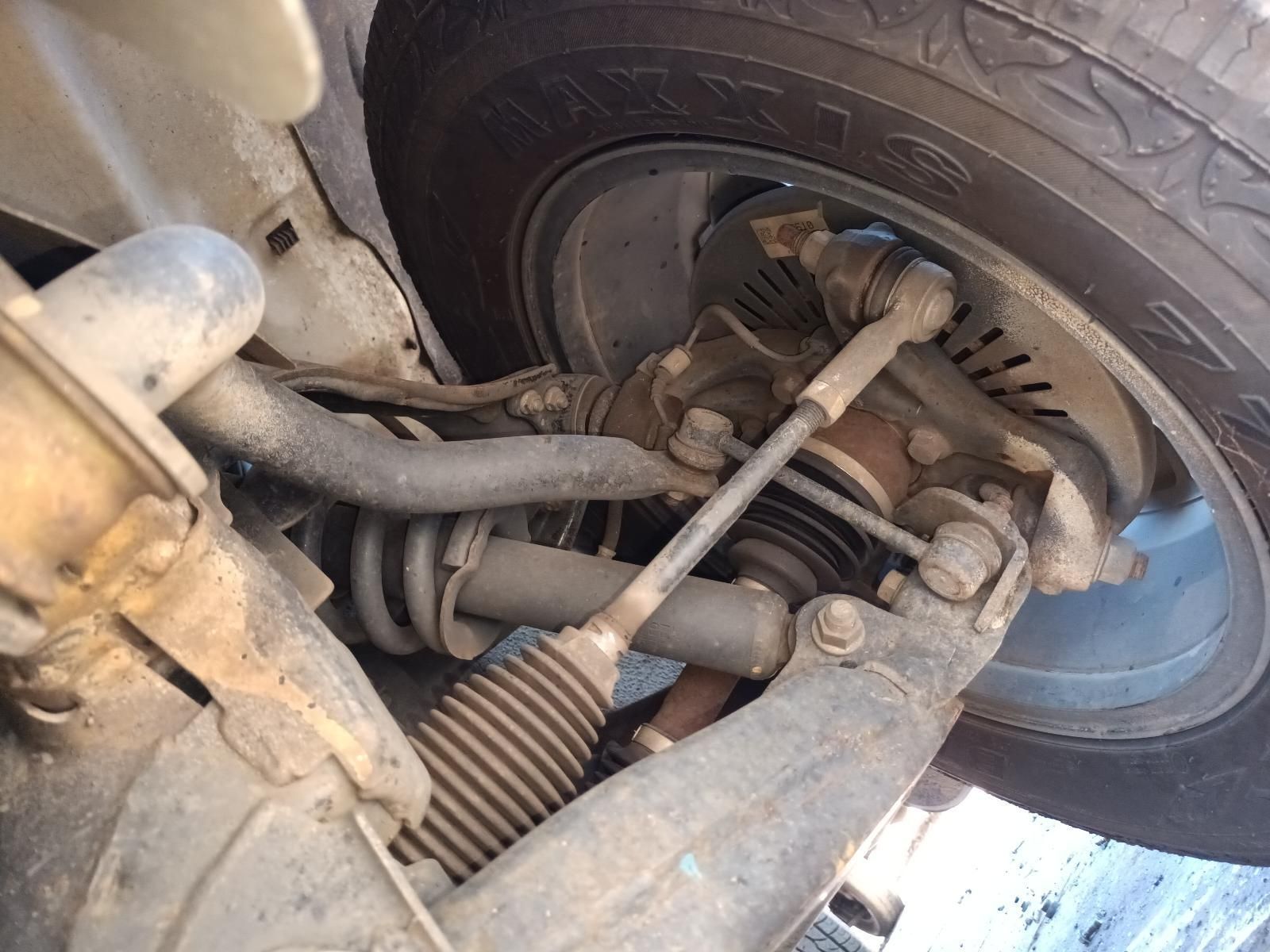 A Close Up of the Underside of a Car with a Tire — South West 4WD Wreckers in Harristown, QLD