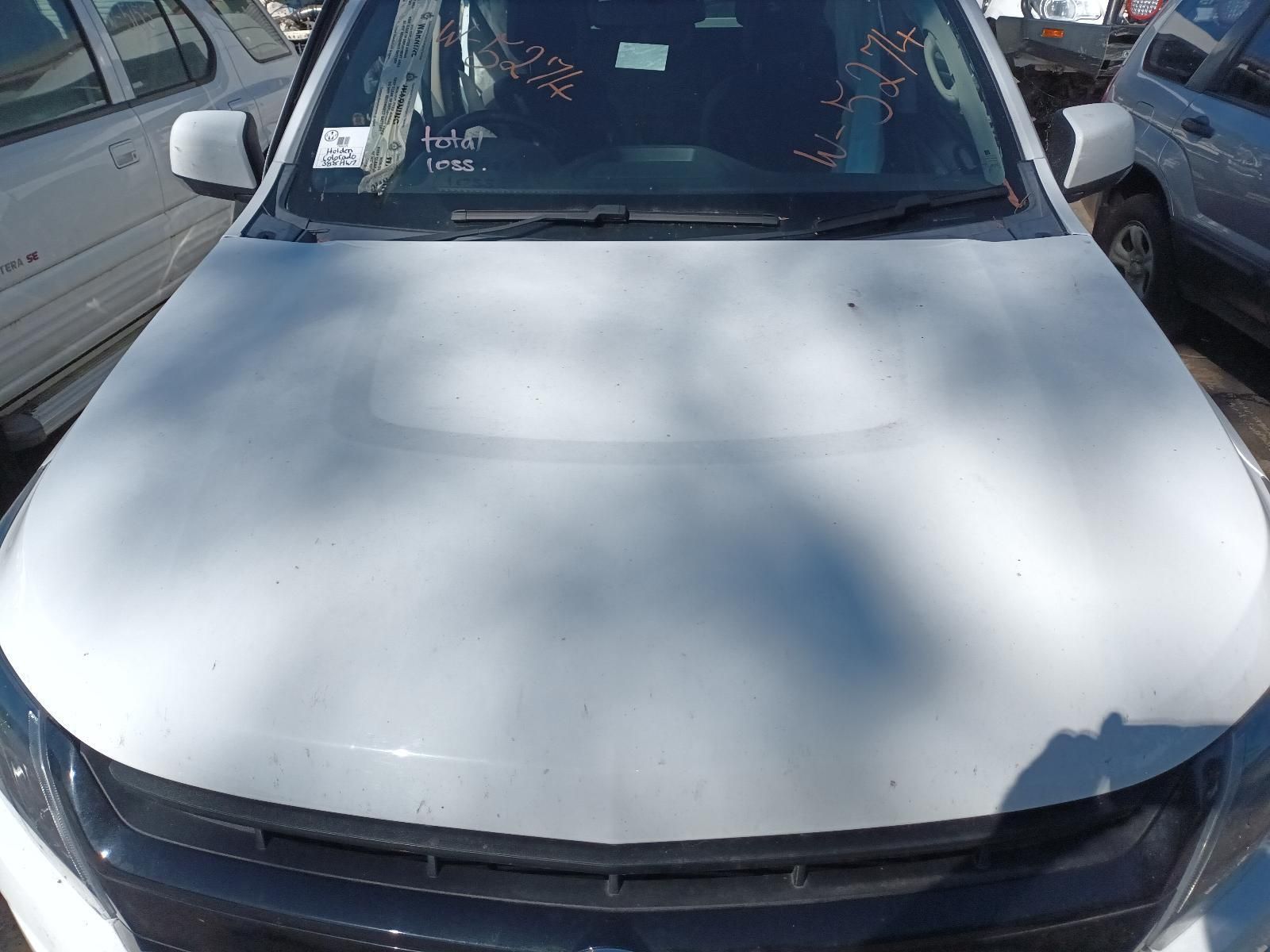 A White Car with the Hood Up is Parked in a Parking Lot — South West 4WD Wreckers in Harristown, QLD
