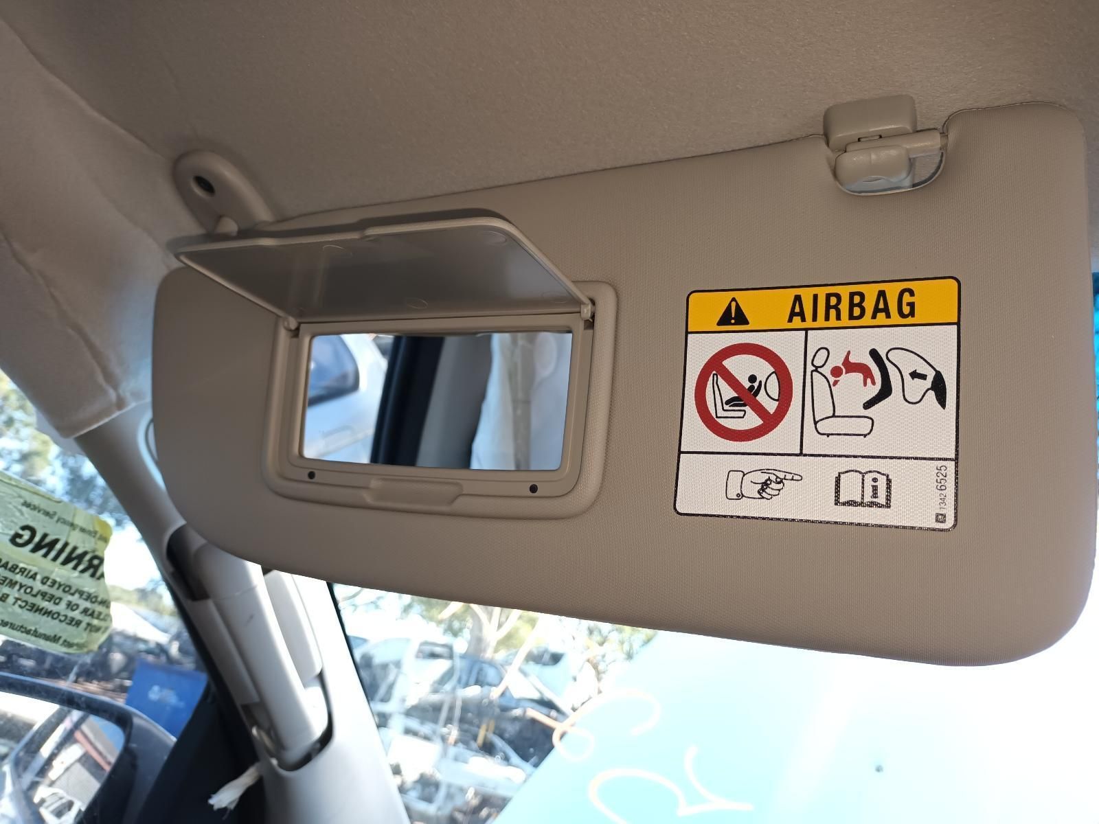 A Sun Visor with a Warning Sign on It That Says Airbag — South West 4WD Wreckers in Harristown, QLD