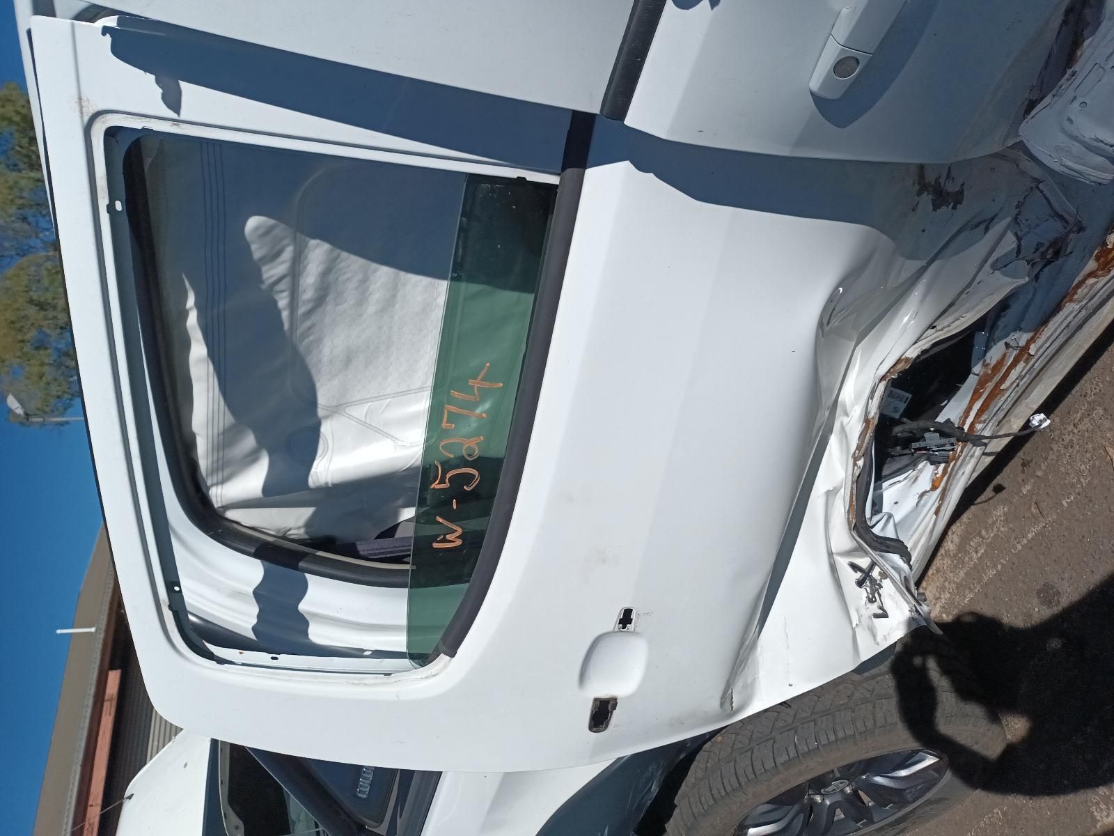 The Back Door of a White Car is Missing — South West 4WD Wreckers in Harristown, QLD