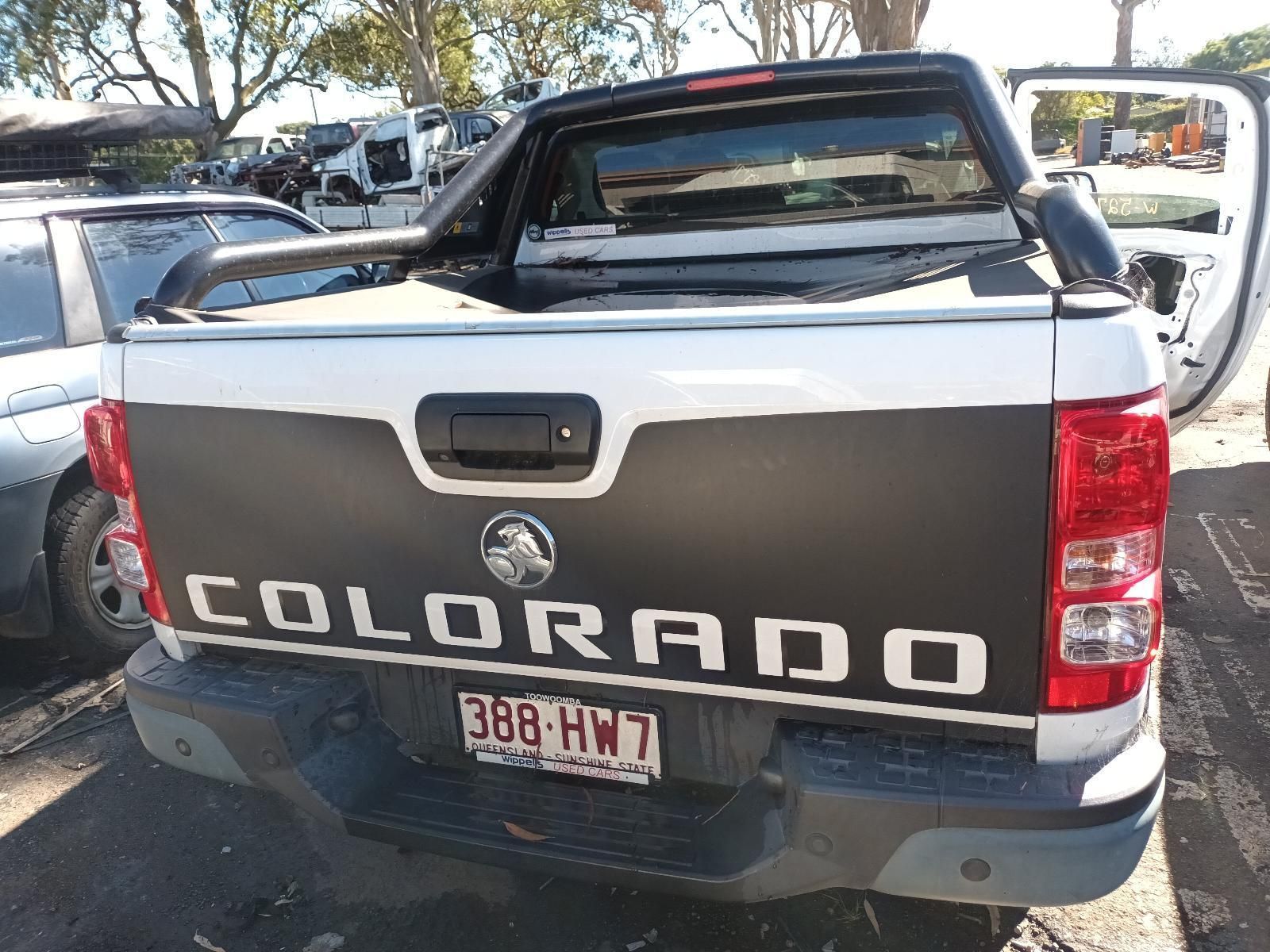 A White and Black Colorado Truck is Parked in a Parking Lot — South West 4WD Wreckers in Harristown, QLD