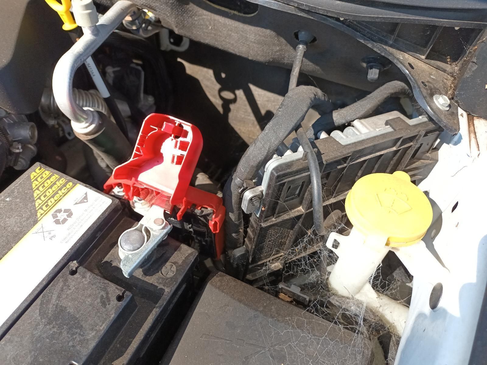 A Close Up of a Car Engine with a Battery and a Yellow Cap — South West 4WD Wreckers in Harristown, QLD