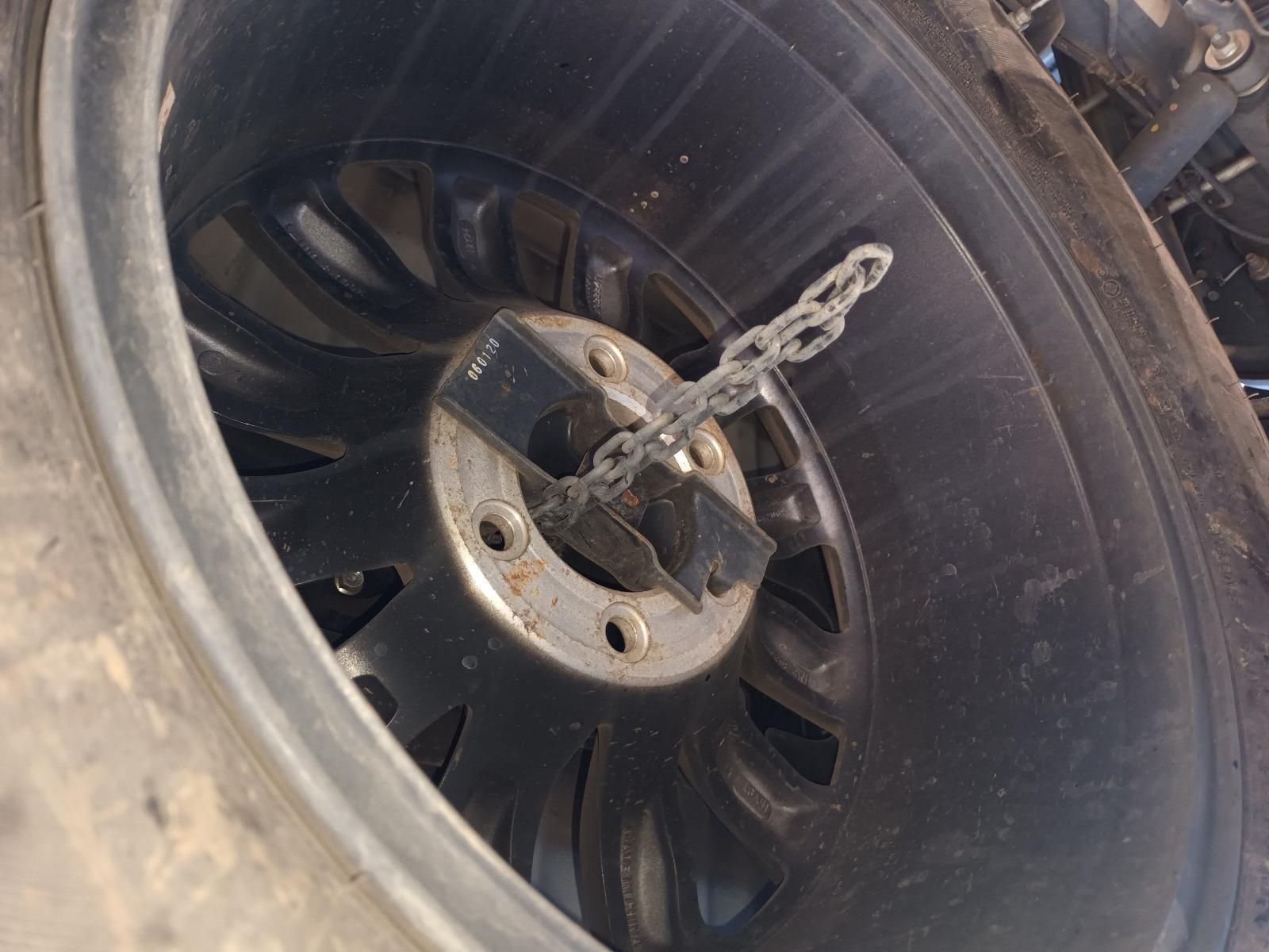 A Close Up of a Tire with a Chain Attached to It — South West 4WD Wreckers in Harristown, QLD