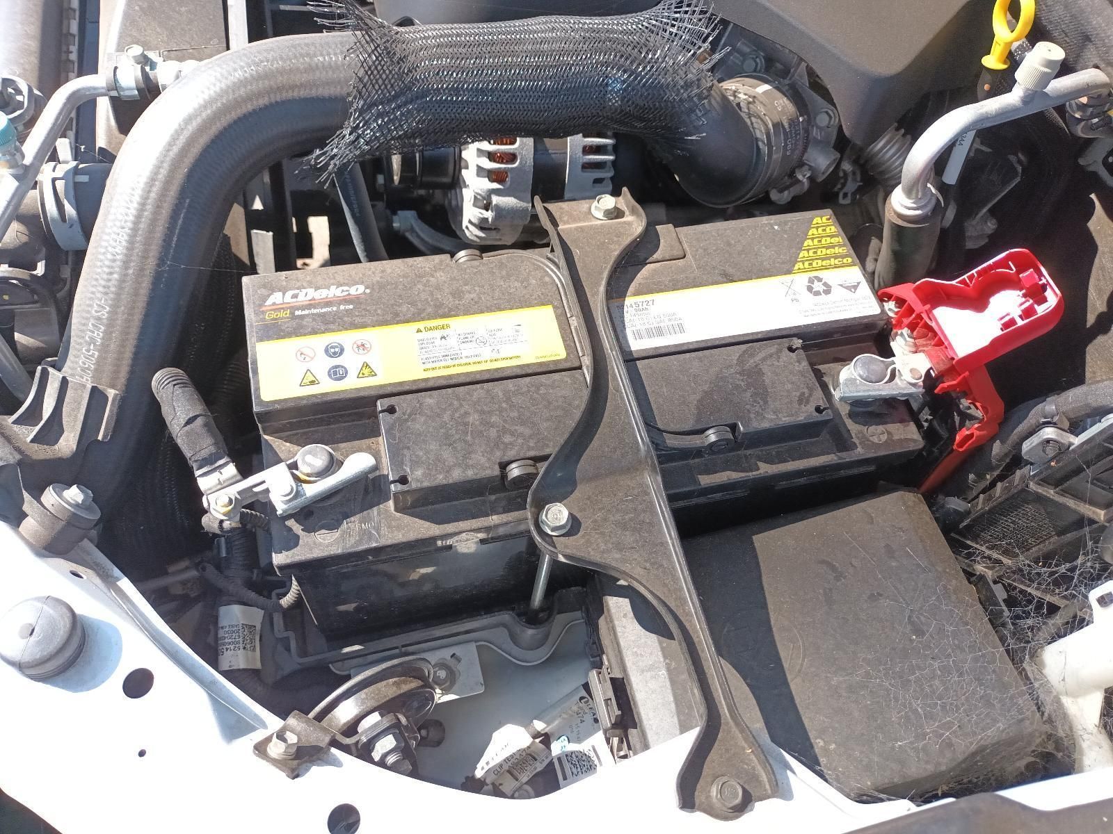 An Acdelco Battery is Sitting Under the Hood of a Car — South West 4WD Wreckers in Harristown, QLD