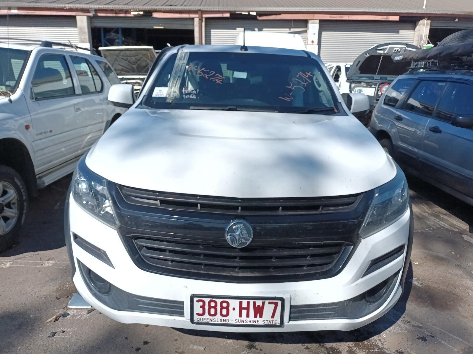 A White Car with a License Plate That Says 388 HW7 — South West 4WD Wreckers in Harristown, QLD